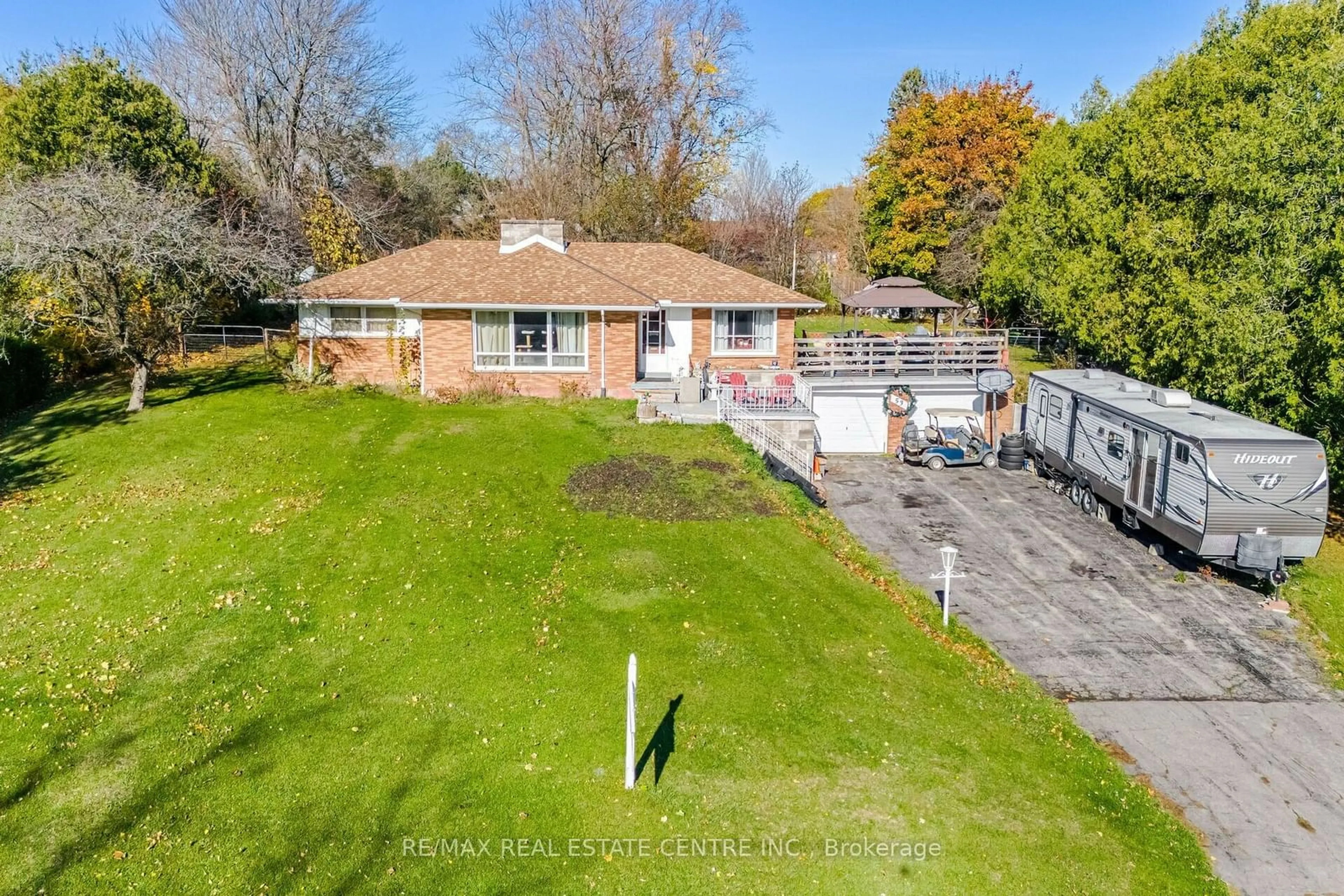 Frontside or backside of a home, the fenced backyard for 53 Cherry St, Norfolk Ontario N3Y 1B3