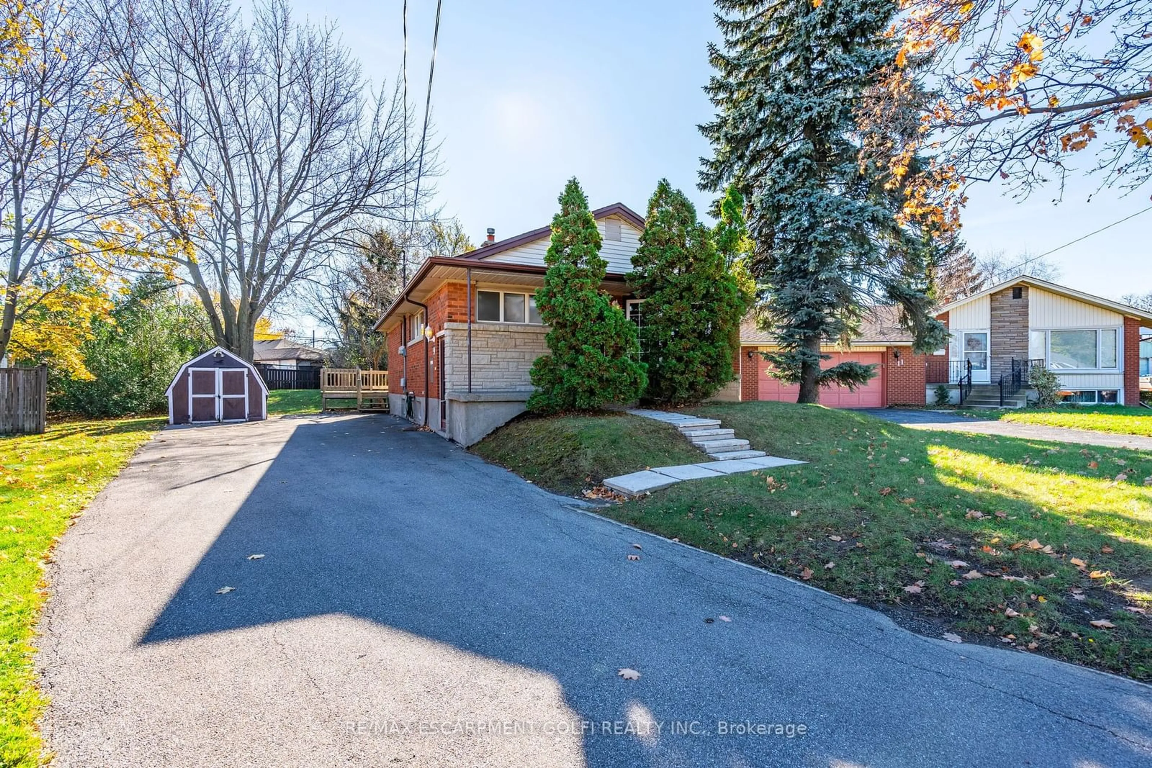 Frontside or backside of a home, the fenced backyard for 9 Thomson Crt, Hamilton Ontario L8V 3C1