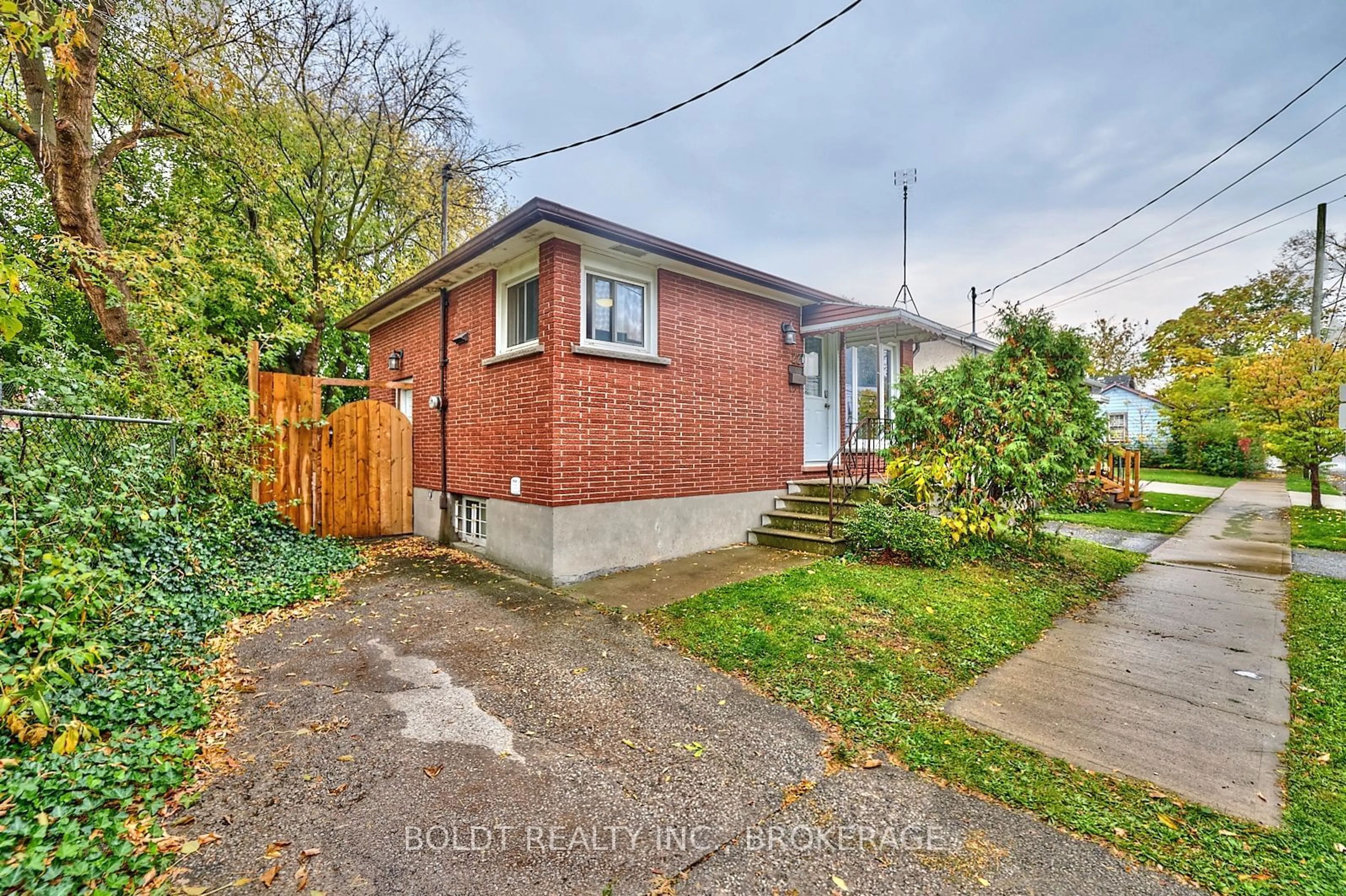 Frontside or backside of a home, the fenced backyard for 22 Greenlaw Pl, St. Catharines Ontario L2R 4S6