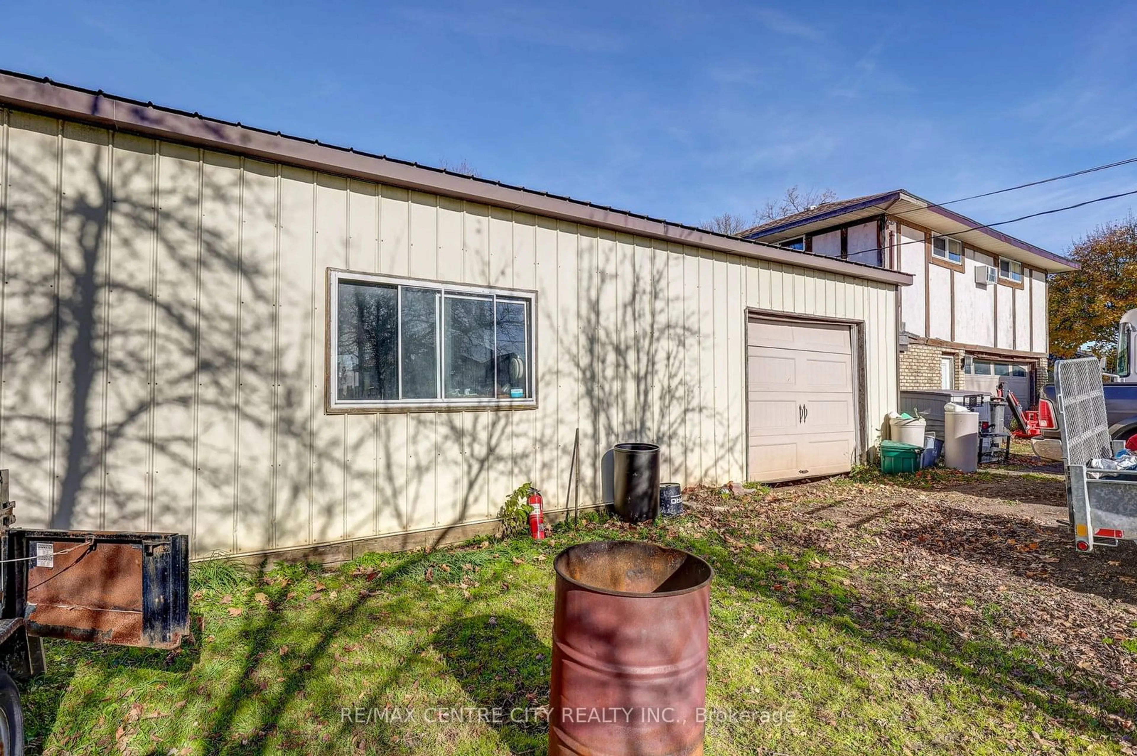 Frontside or backside of a home, the fenced backyard for 11709 Tracey St, Malahide Ontario N0L 2J0