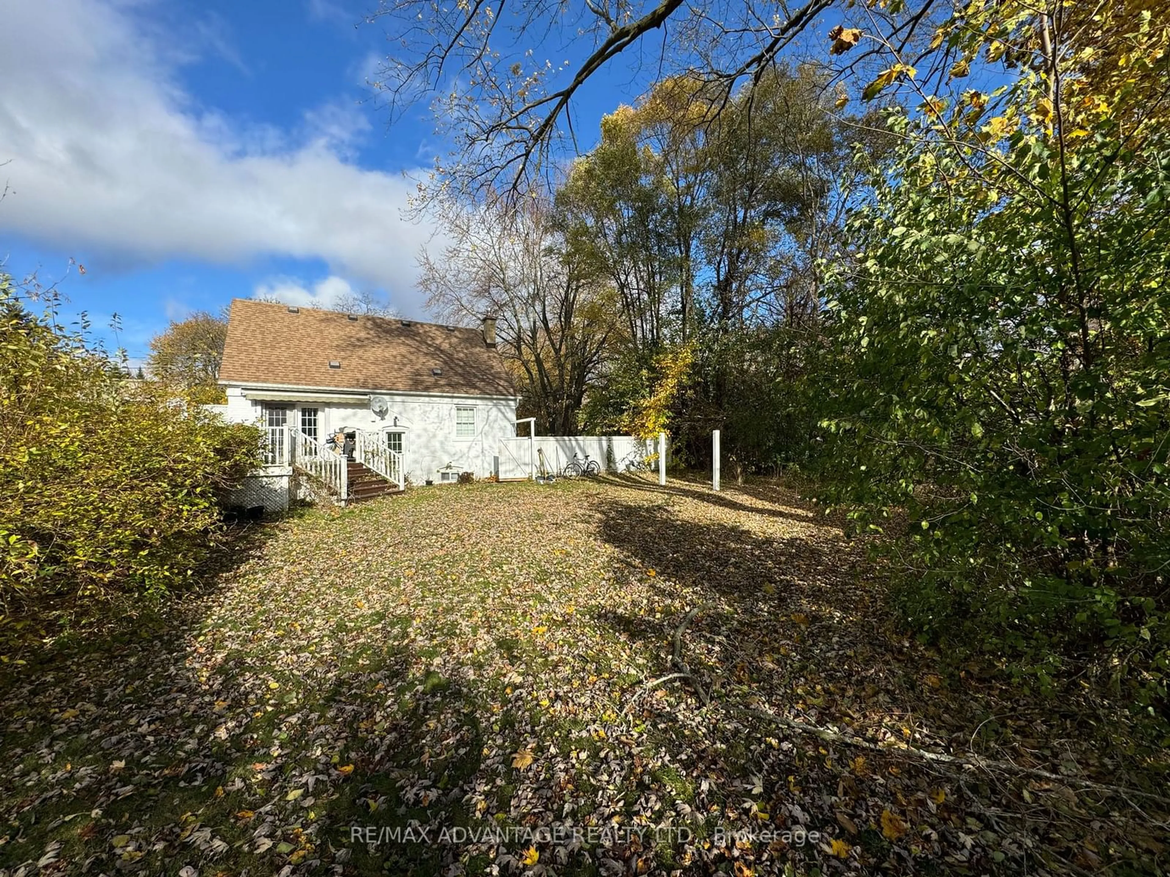 Frontside or backside of a home, the fenced backyard for 4 Lincoln Cres, Guelph Ontario N1E 1Y8