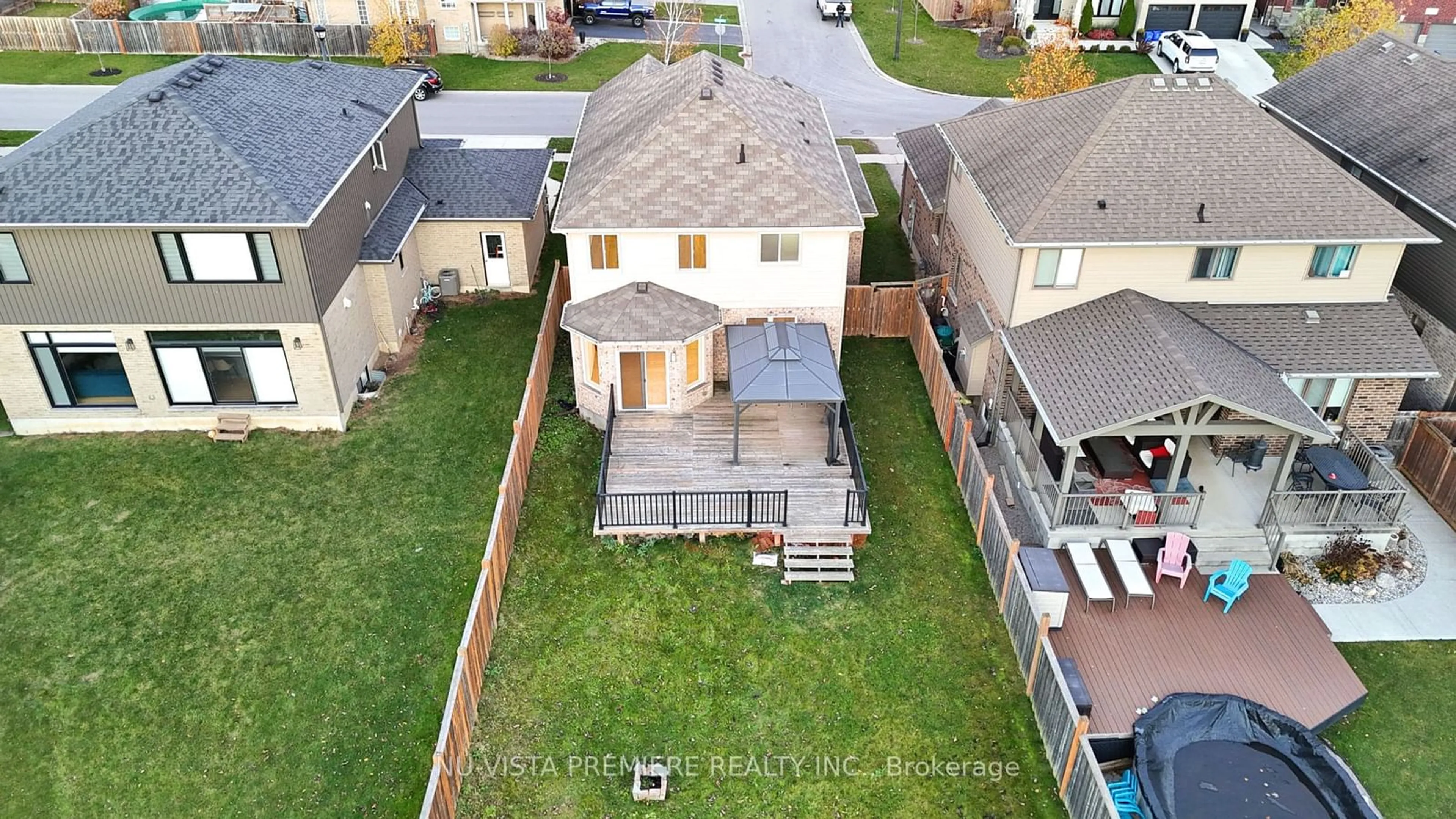 Frontside or backside of a home, the fenced backyard for 2427 Yellowbirch Crt, London Ontario N6G 0L2