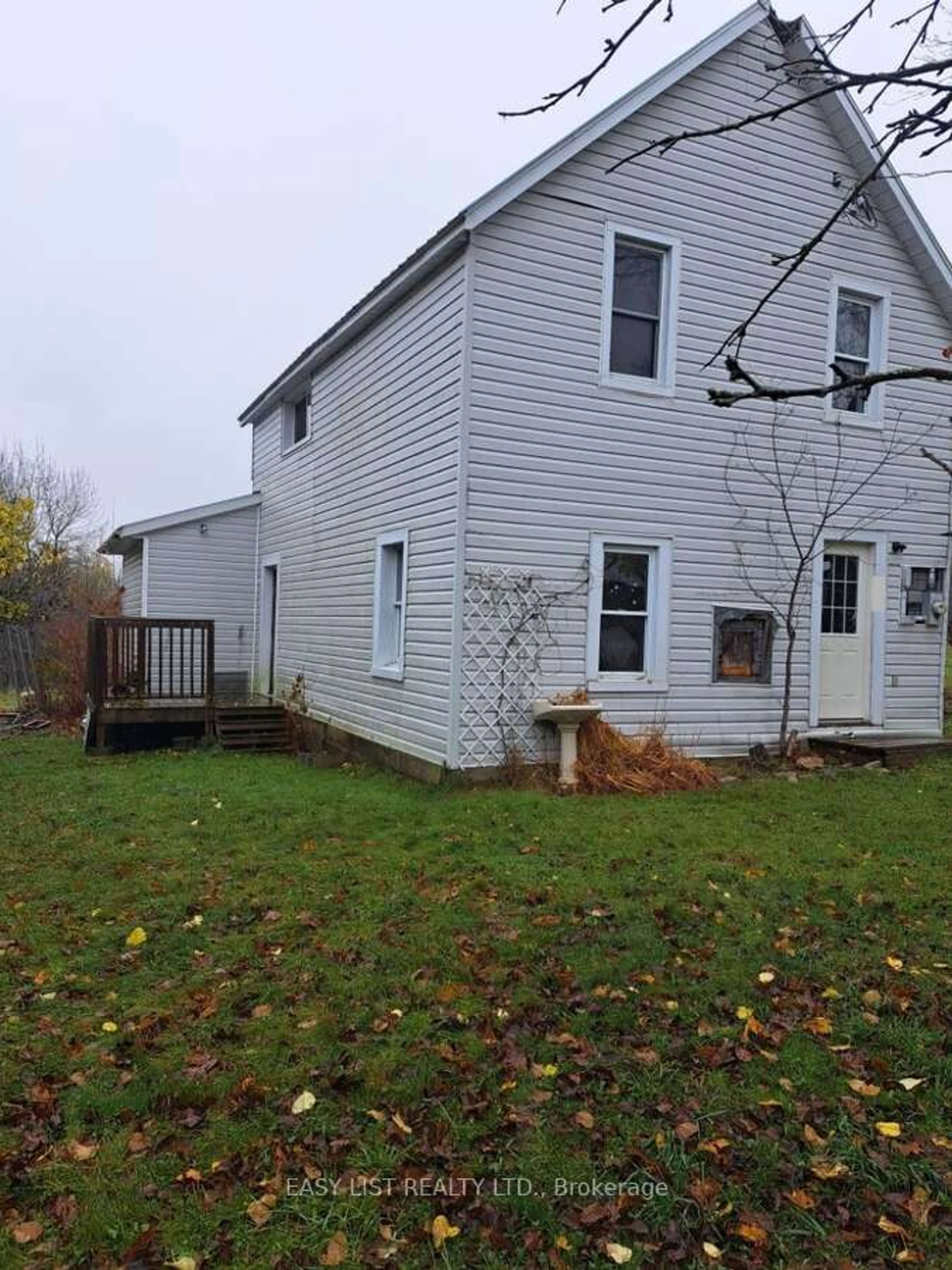 Frontside or backside of a home, the fenced backyard for 14 New St, Gore Bay Ontario P0P 1H0