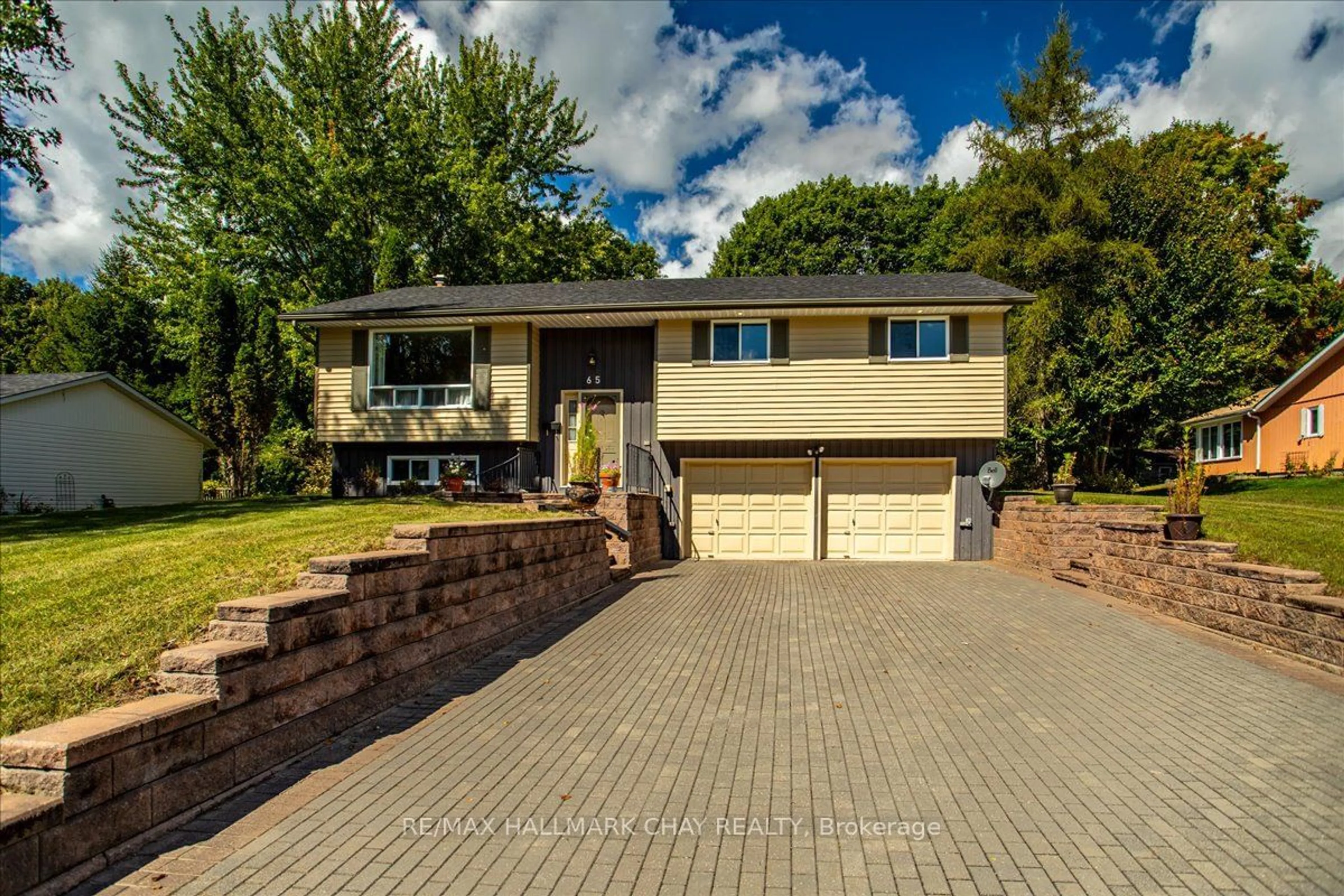 Home with brick exterior material for 65 Meadow Heights Dr, Bracebridge Ontario P1L 1A3