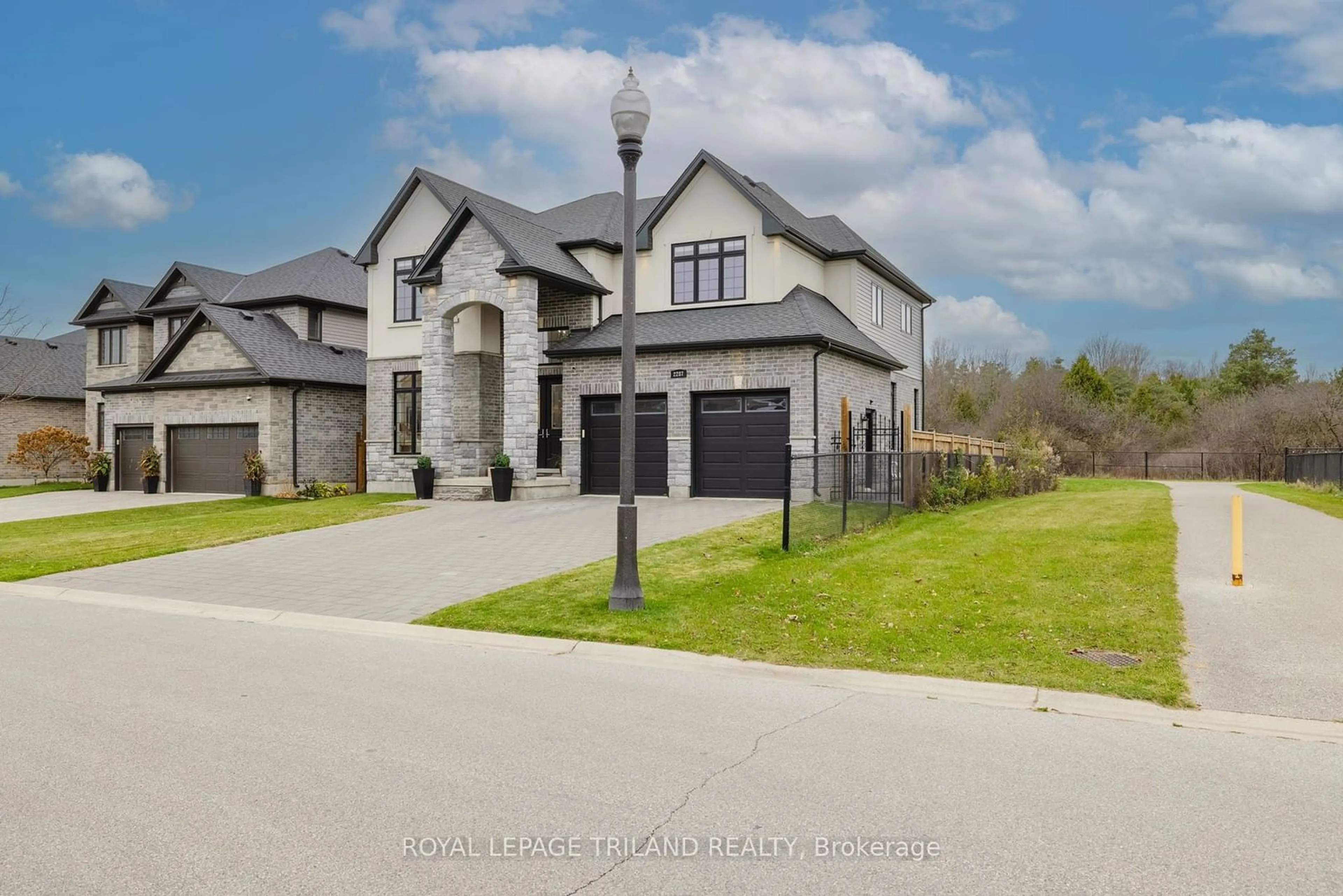 Frontside or backside of a home, the street view for 2287 Springridge Dr, London Ontario N5X 0J7