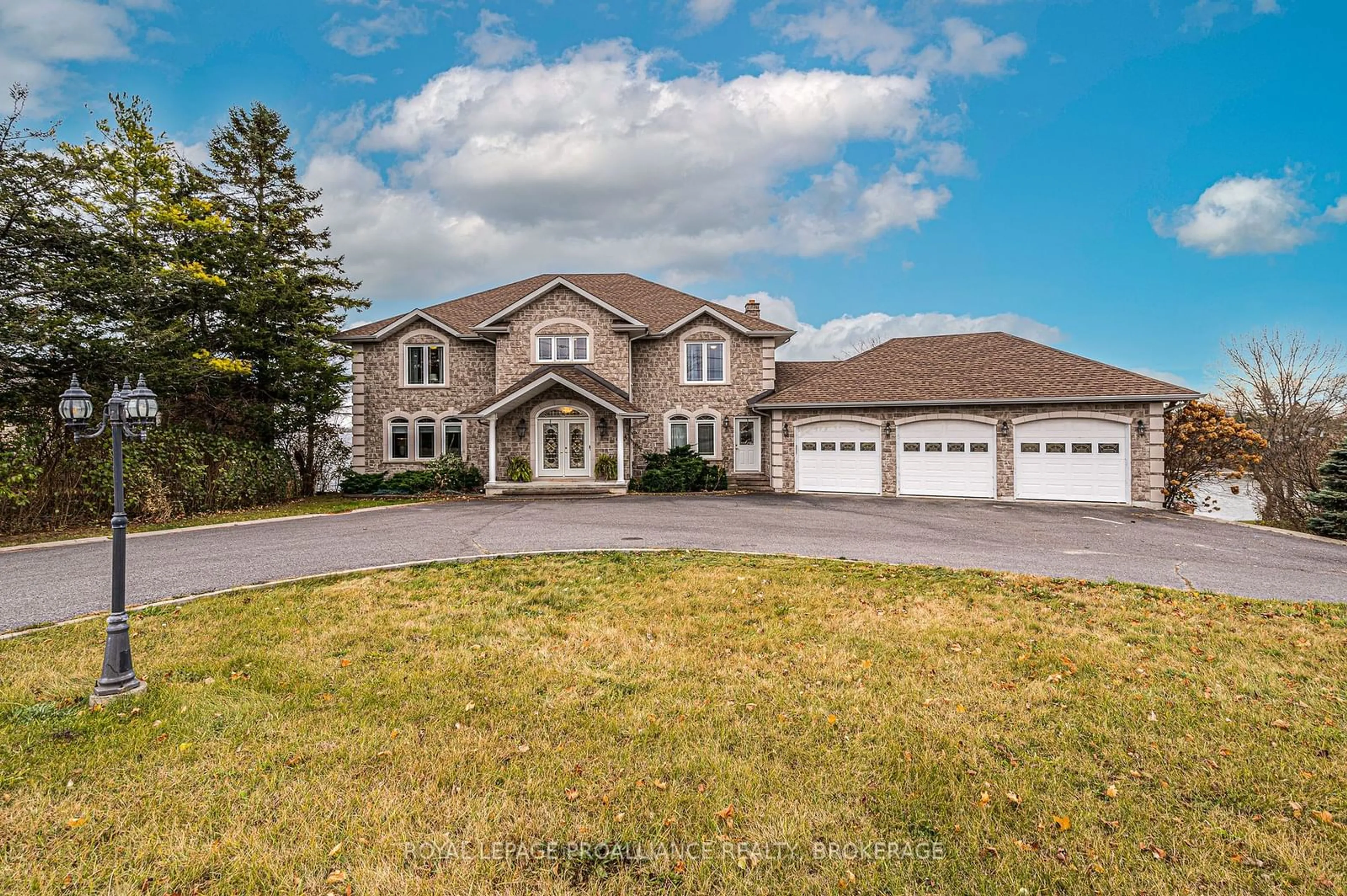 Frontside or backside of a home, the street view for 4734 Lakeside Lane, Loyalist Ontario K0H 1G0