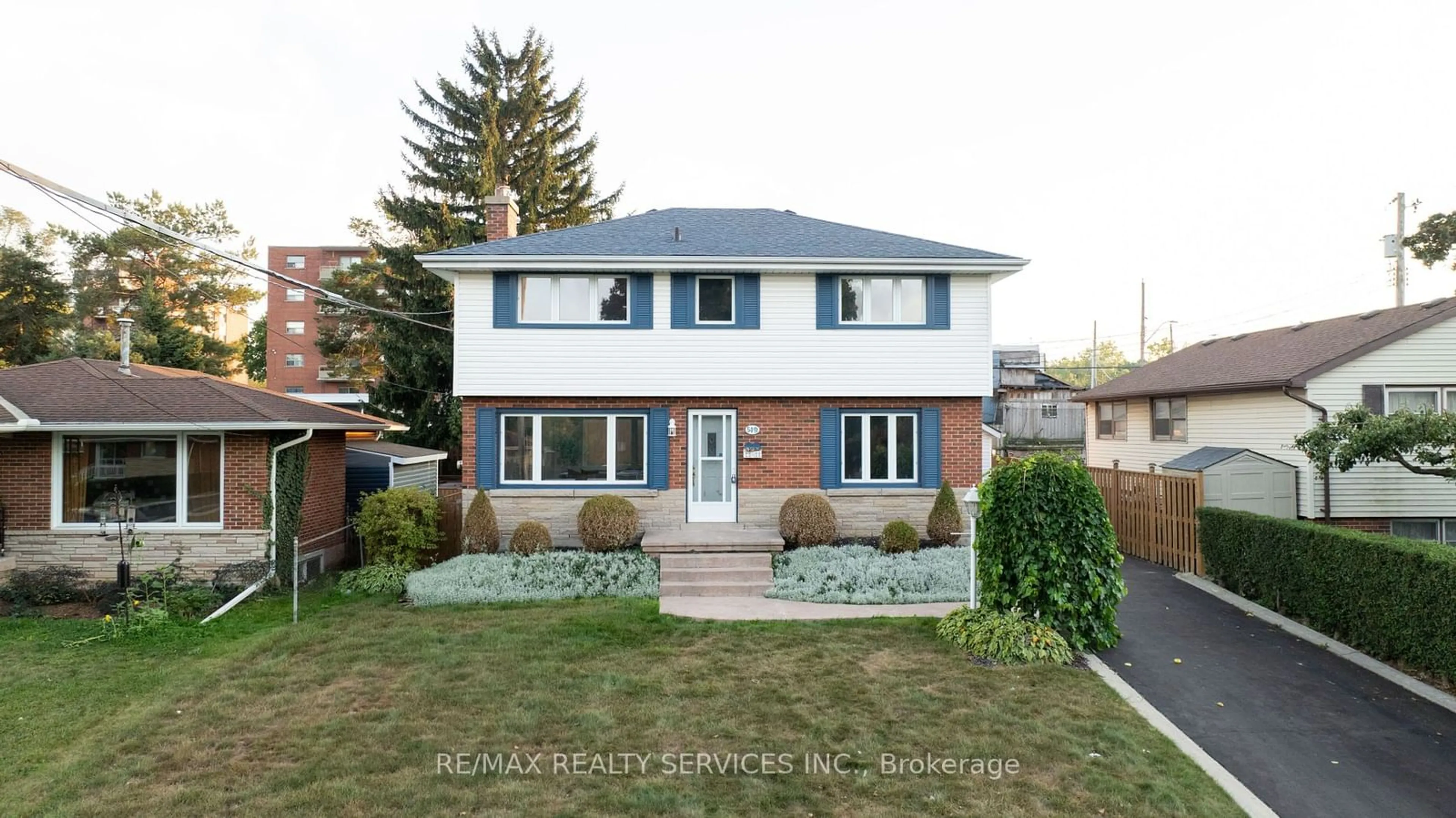 Frontside or backside of a home, the fenced backyard for 54 Orphir Rd, Hamilton Ontario L8K 3Z2