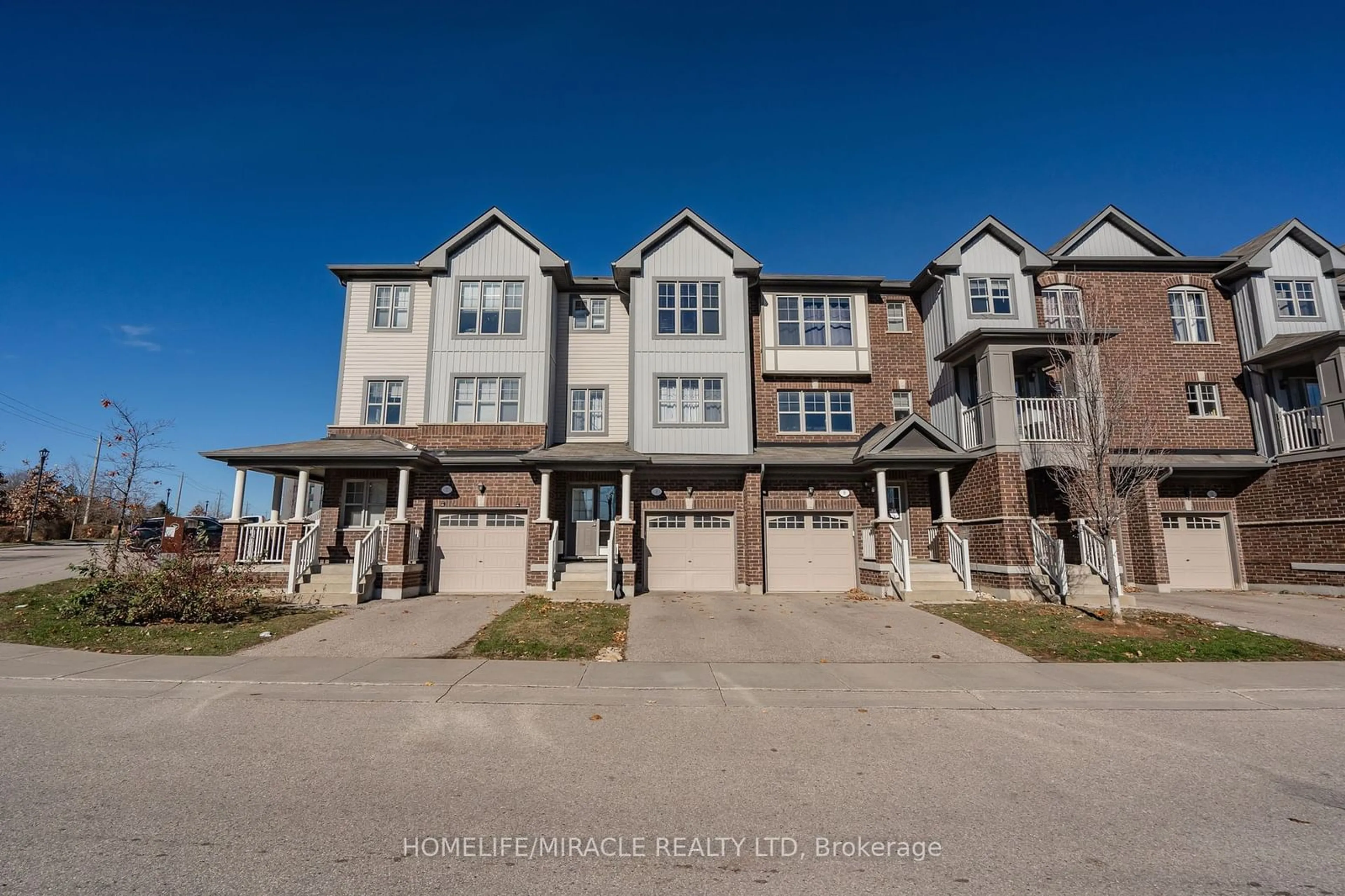 A pic from exterior of the house or condo, the street view for 701 Homer Watson Blvd #8, Kitchener Ontario N2C 0B5