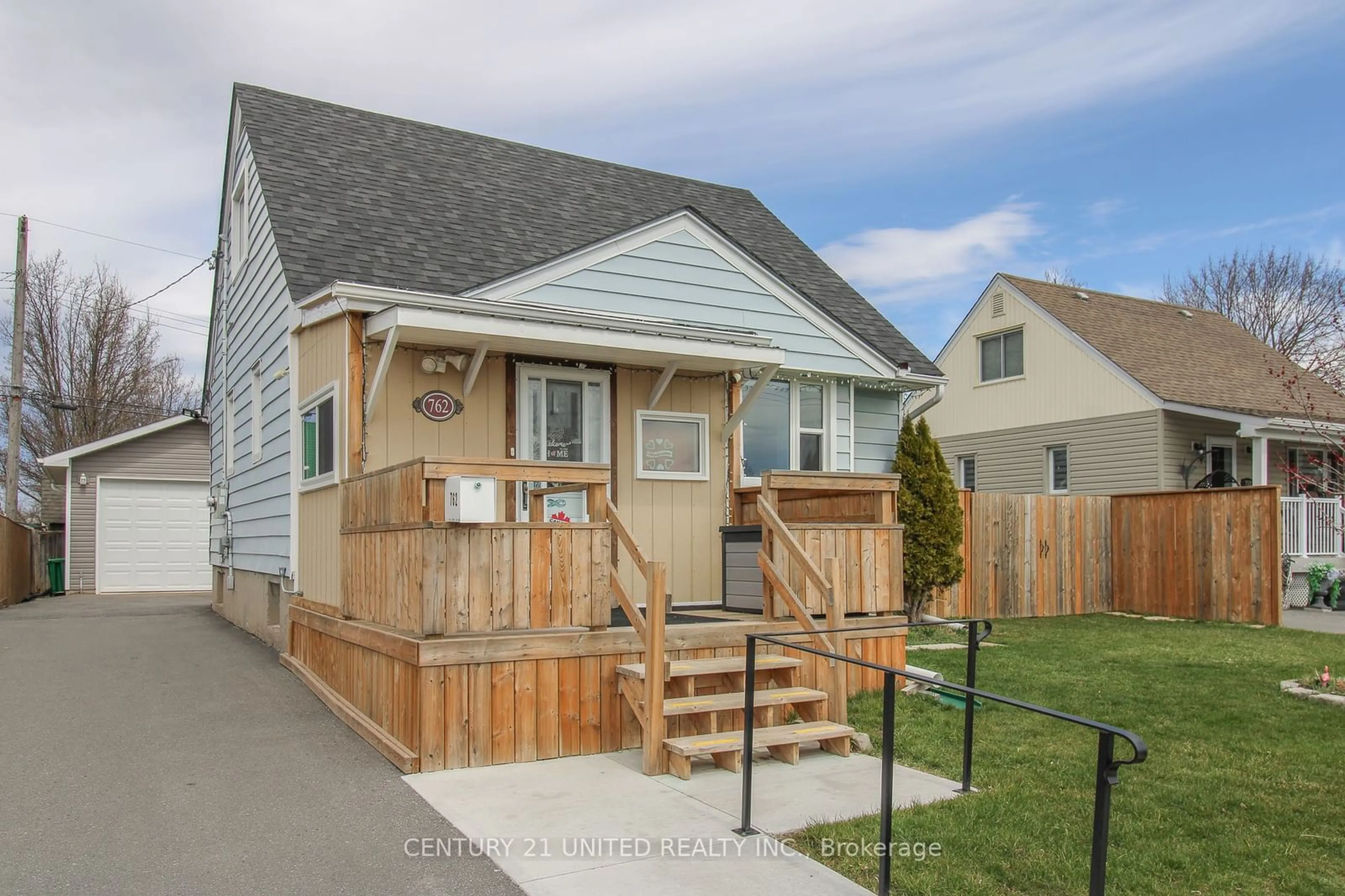 Frontside or backside of a home, the fenced backyard for 762 Gillespie Ave, Peterborough Ontario K9J 4B7