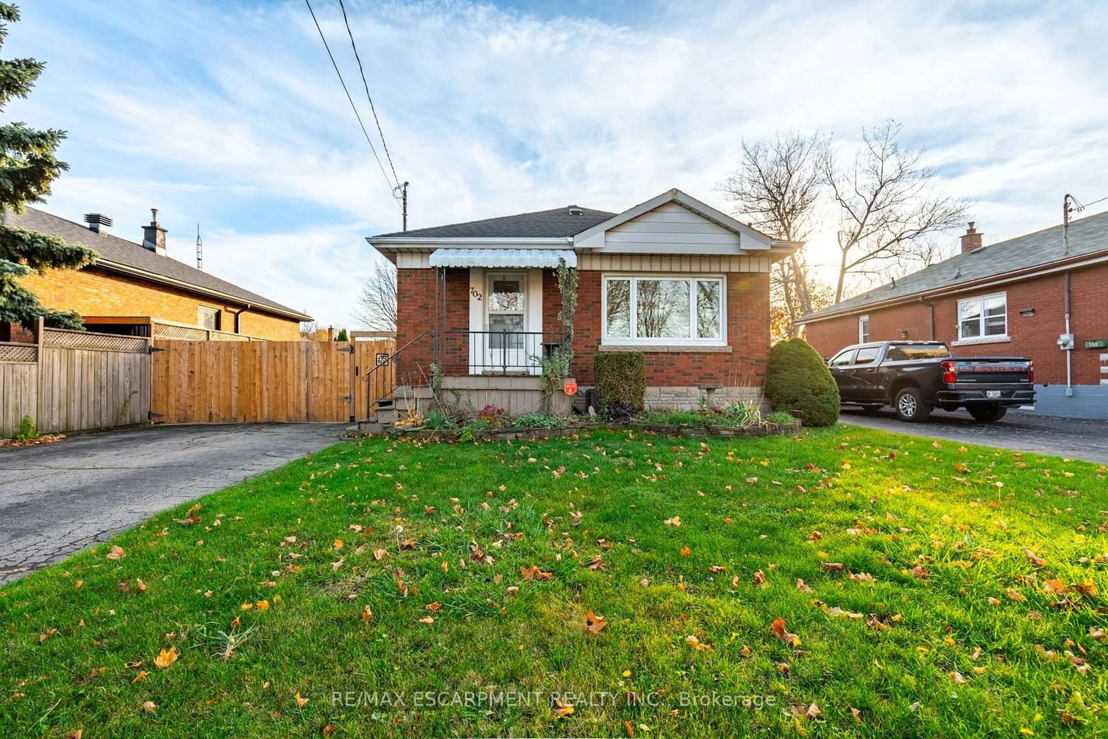 Frontside or backside of a home, the fenced backyard for 702 SEVENTH Ave, Hamilton Ontario L8T 1V1