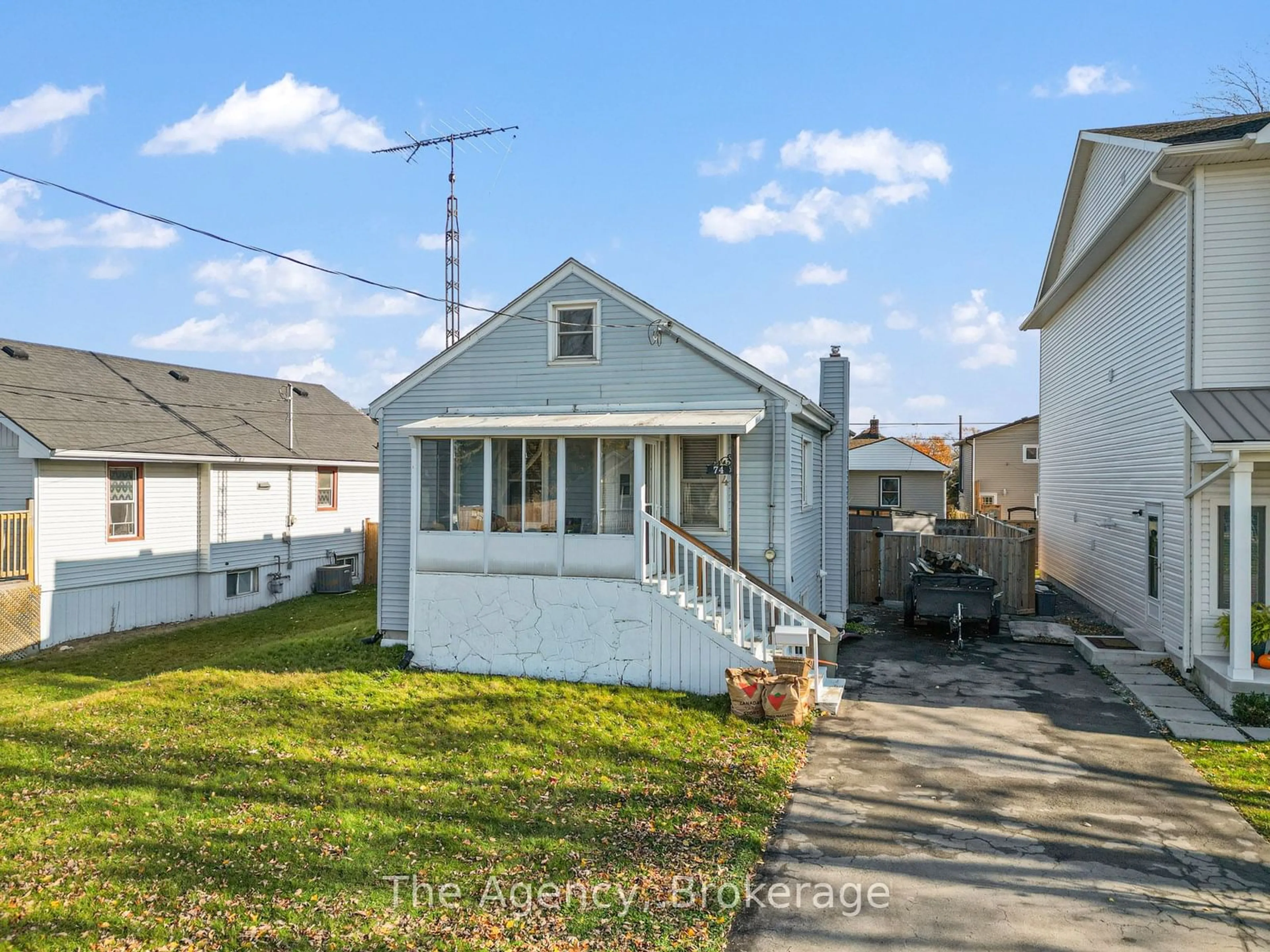 Frontside or backside of a home, the fenced backyard for 74 Knoll St, Port Colborne Ontario L3K 5A6