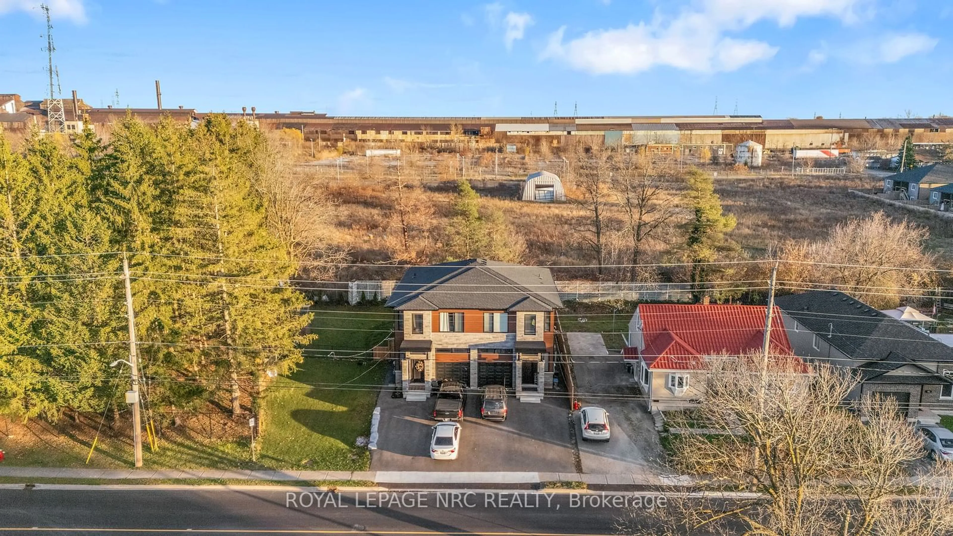 A pic from exterior of the house or condo, the fenced backyard for 318 River Rd, Welland Ontario L3B 2S4