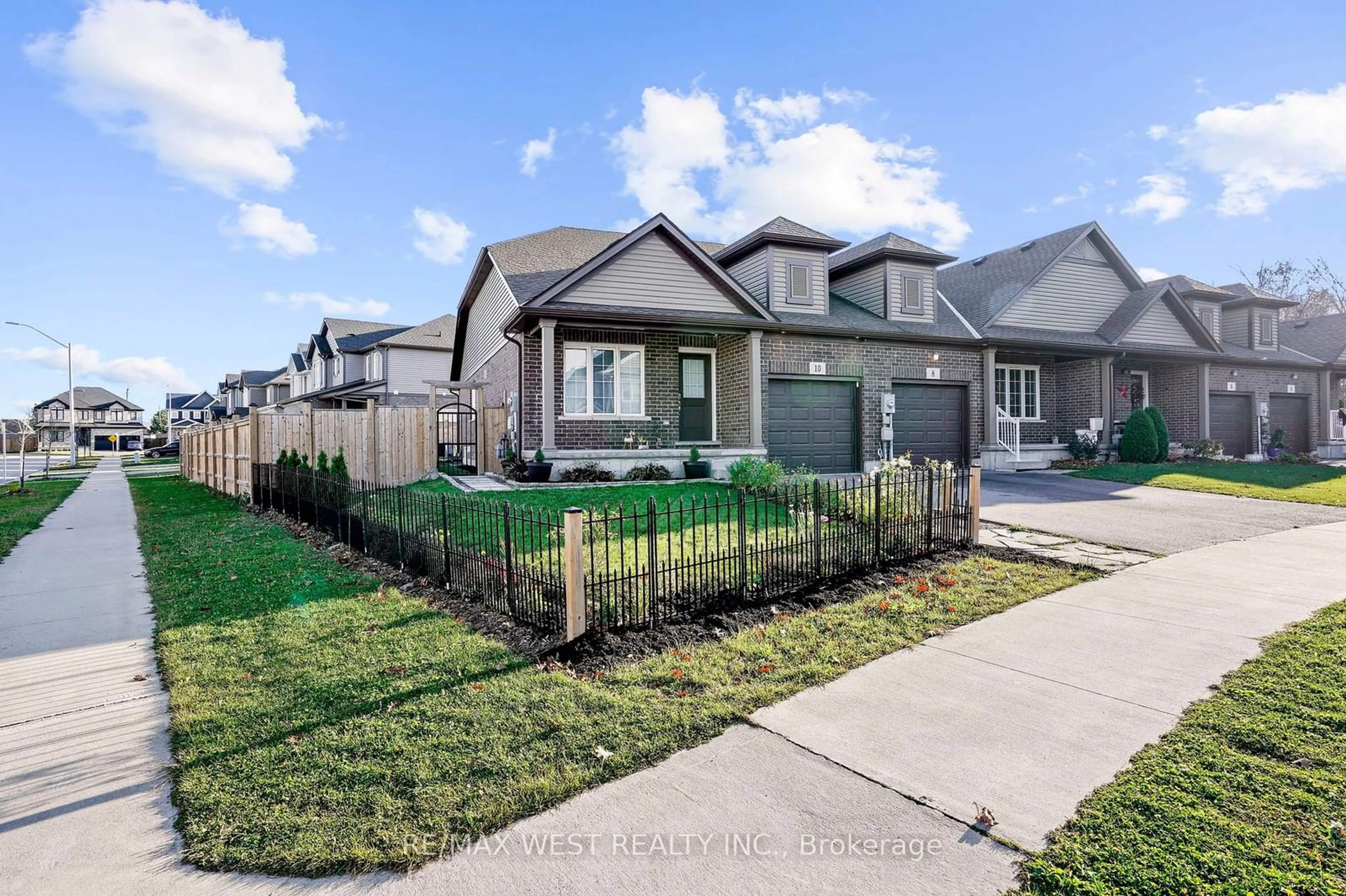 Frontside or backside of a home, the fenced backyard for 10 Hawthorn Ave, Thorold Ontario L2V 0J1