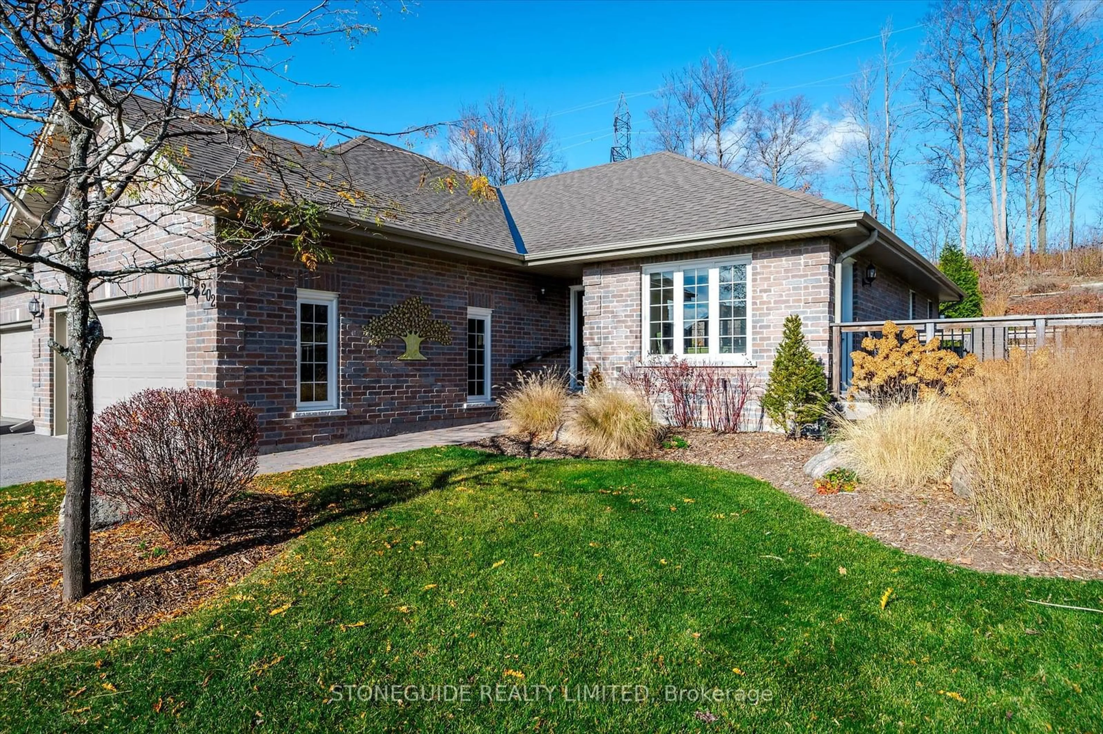 Frontside or backside of a home, the fenced backyard for 301 CARNEGIE Ave #202, Peterborough Ontario K9L 1N2