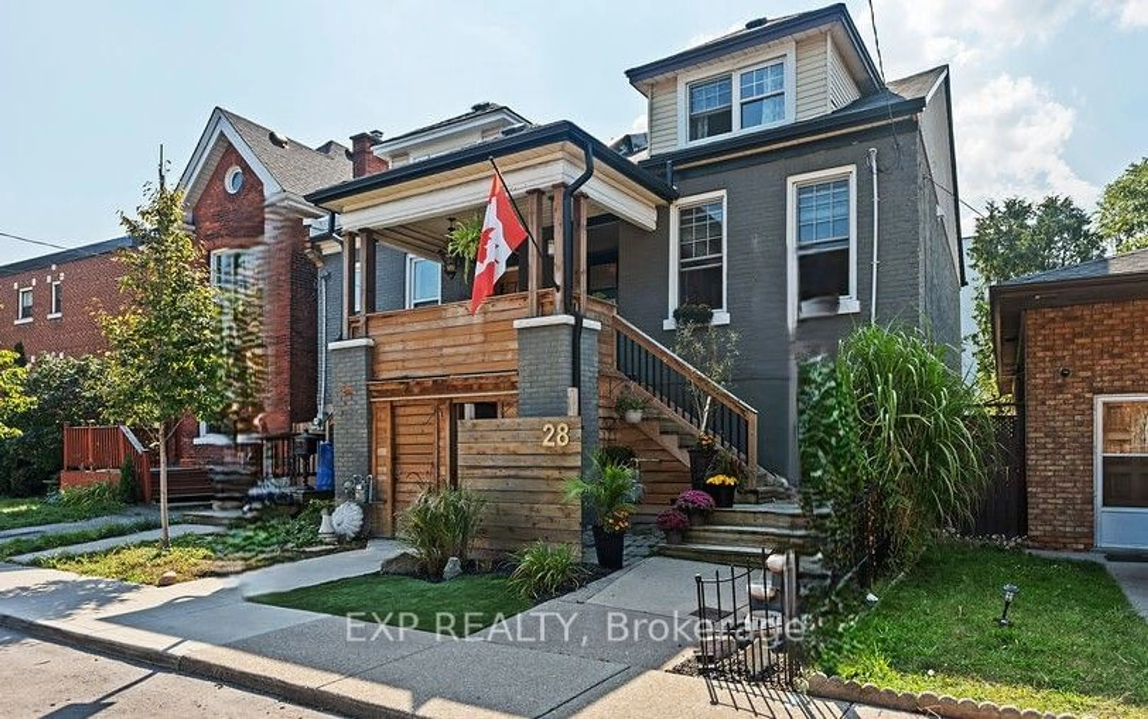 A pic from exterior of the house or condo, the fenced backyard for 28 Grove St, Hamilton Ontario L8N 1P5