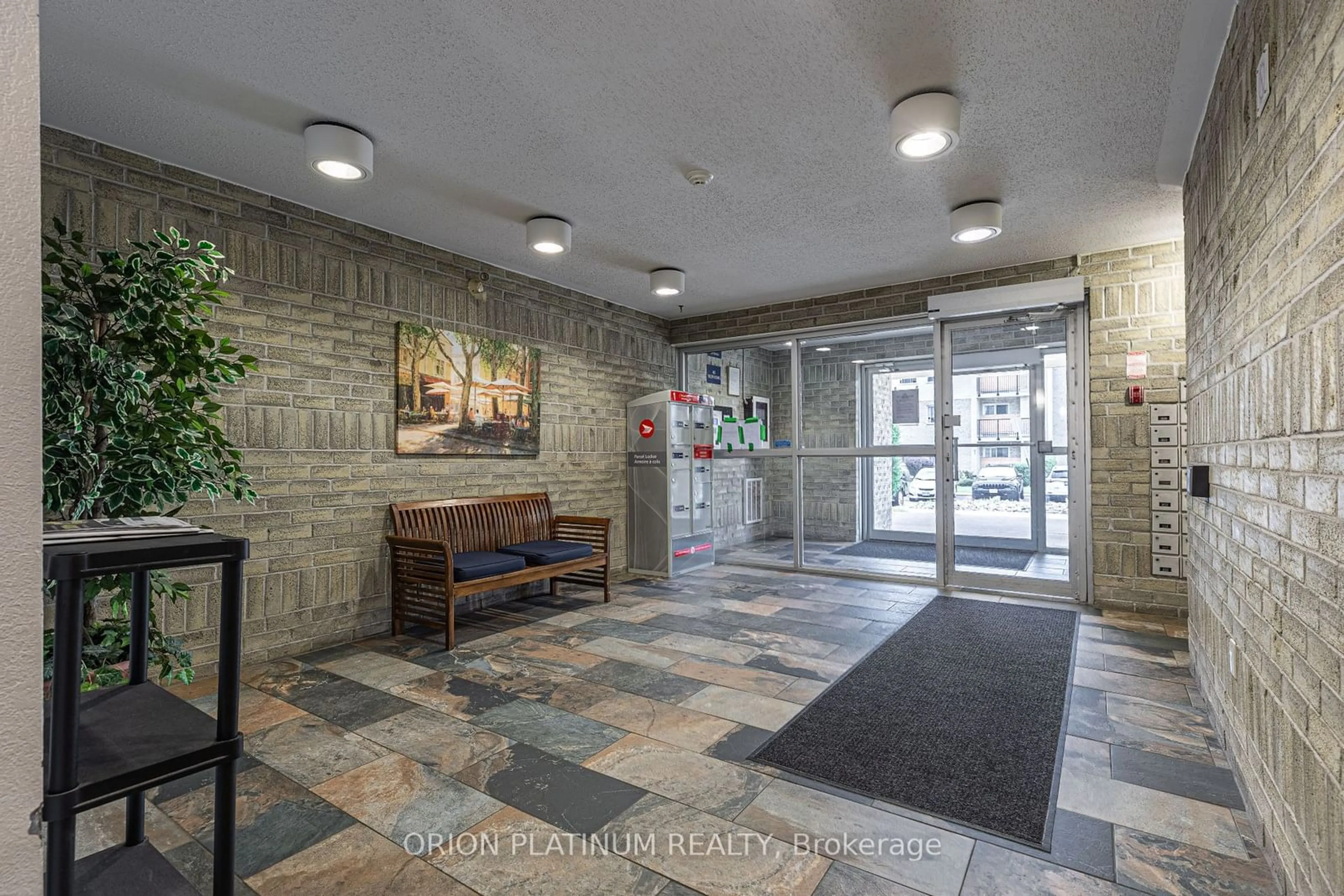 Indoor lobby, cement floor for 733 Deveron Cres #303, London Ontario N5Z 4X7