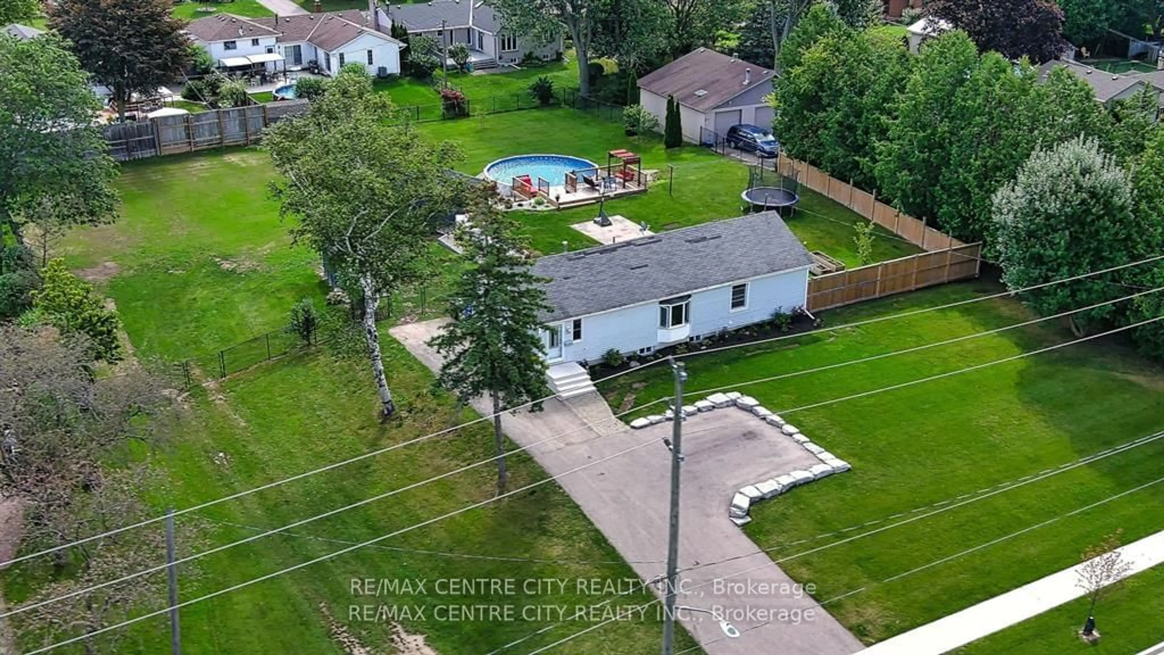 Frontside or backside of a home, the fenced backyard for 161 Fairview Ave, St. Thomas Ontario N5R 4X8