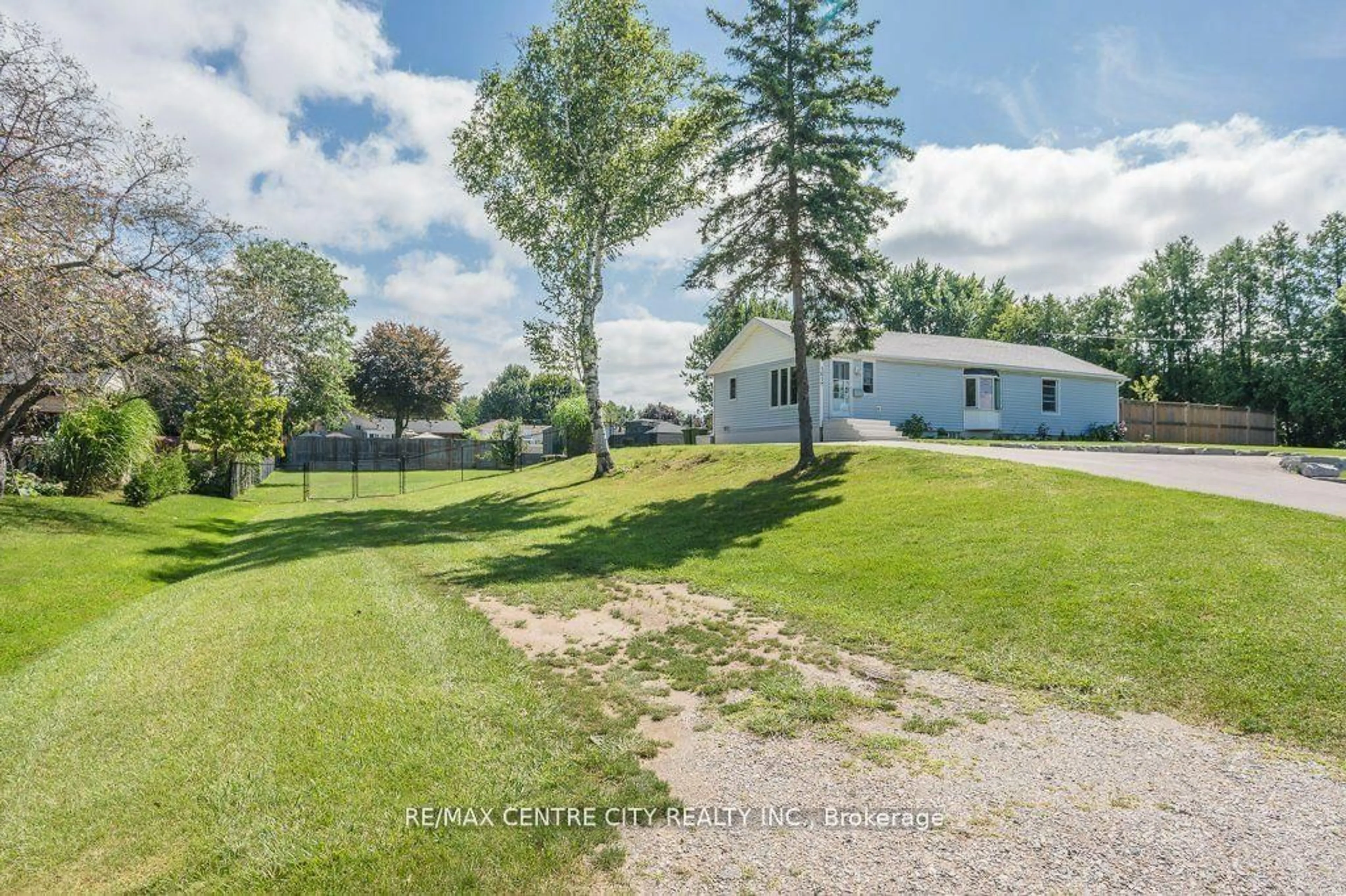 Frontside or backside of a home, the fenced backyard for 161 Fairview Ave, St. Thomas Ontario N5R 4X8