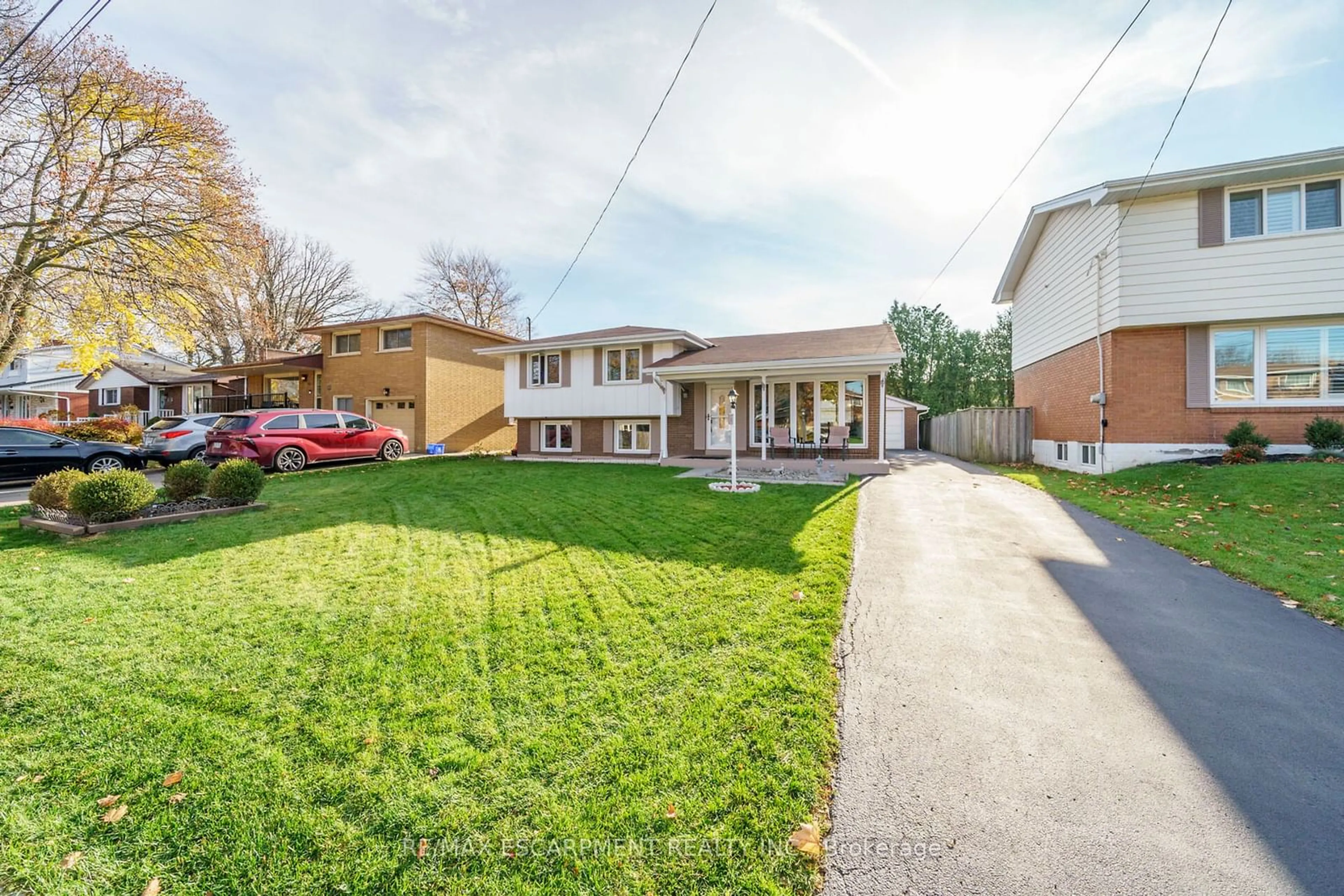 Frontside or backside of a home, the fenced backyard for 32 Morningside Dr, Hamilton Ontario L8T 1P7