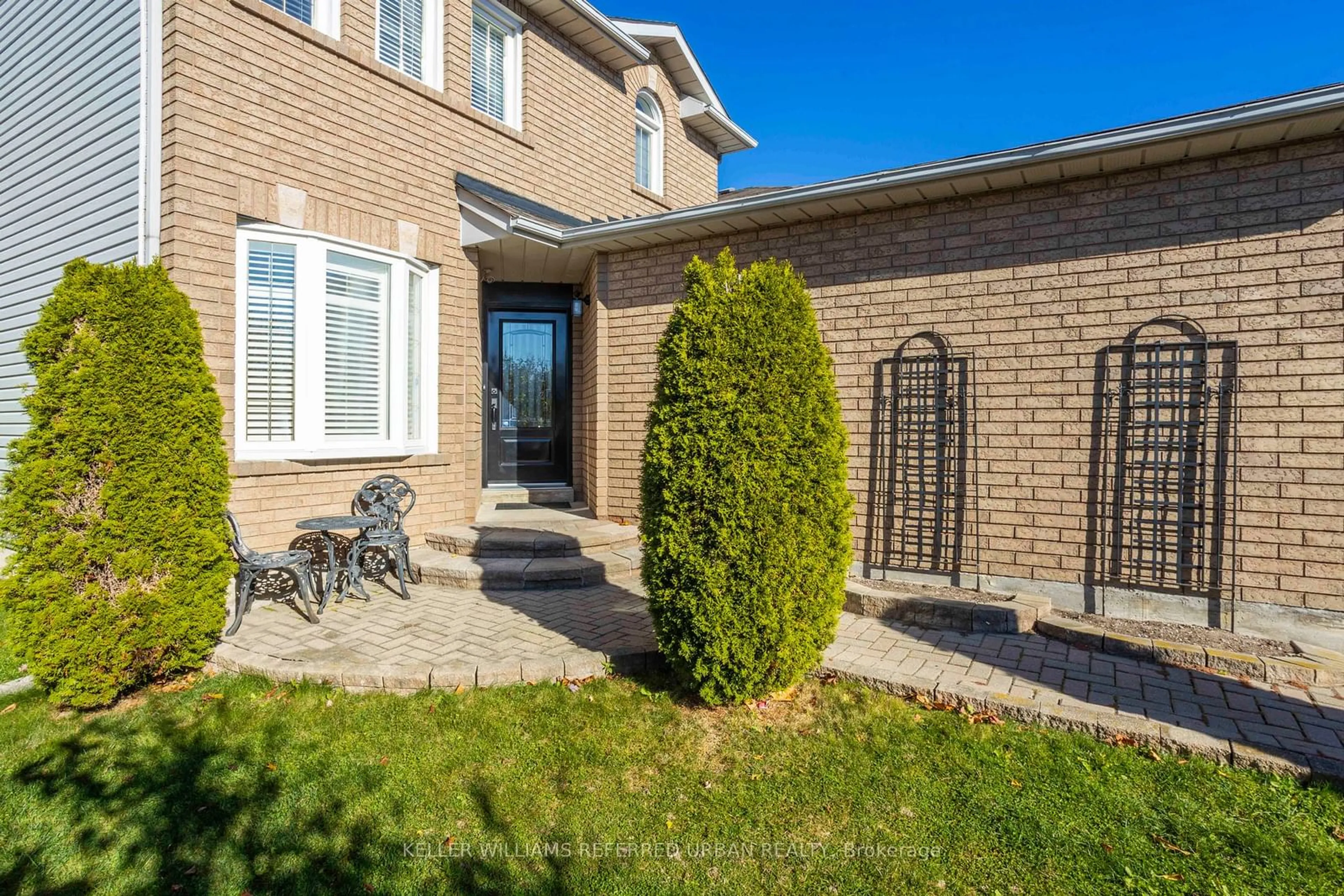 Frontside or backside of a home, the fenced backyard for 214 Sutherland Cres, Cobourg Ontario K9A 5L3