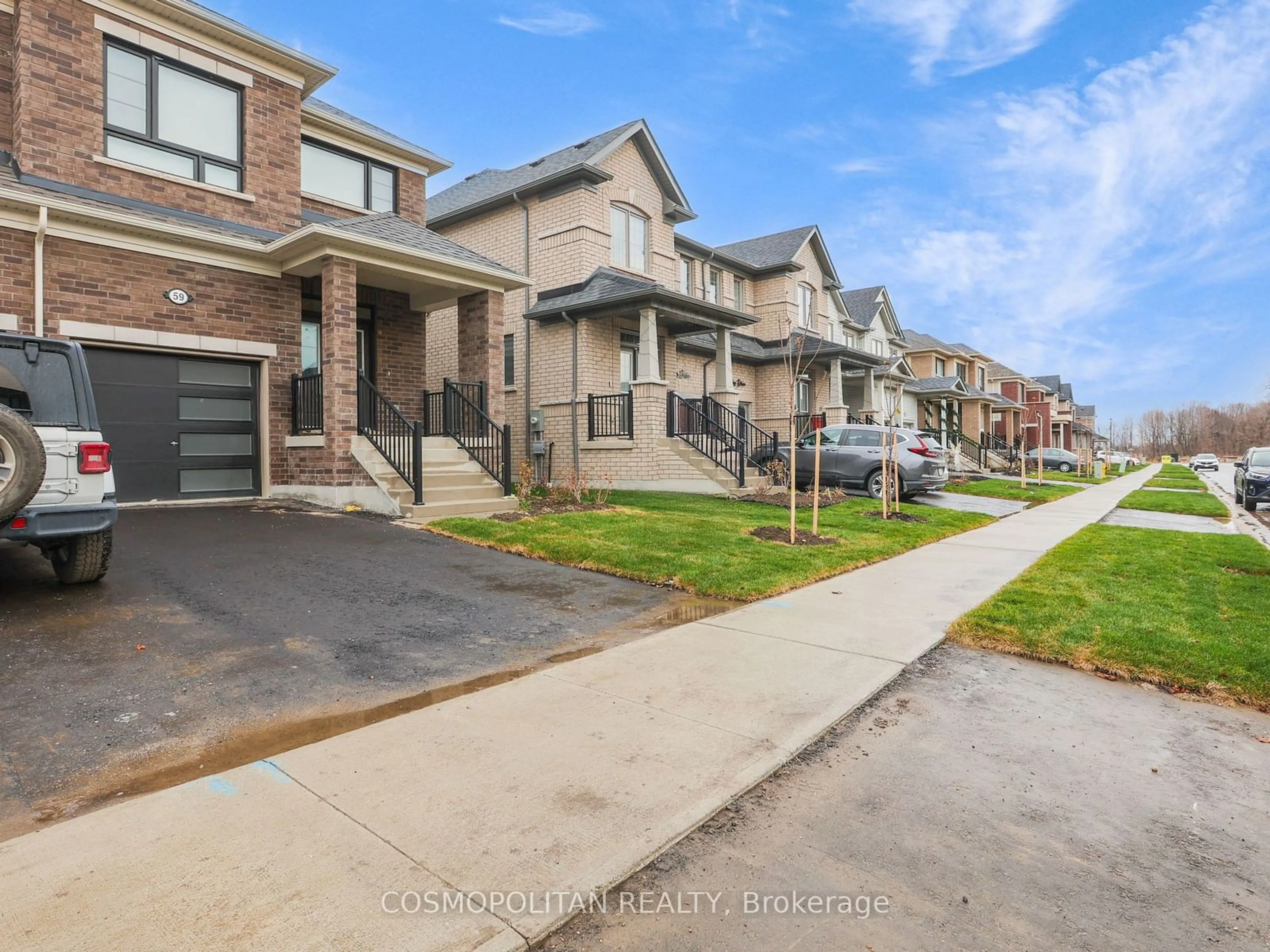 A pic from exterior of the house or condo, the street view for 59 Gauley Dr, Centre Wellington Ontario N1M 2W3