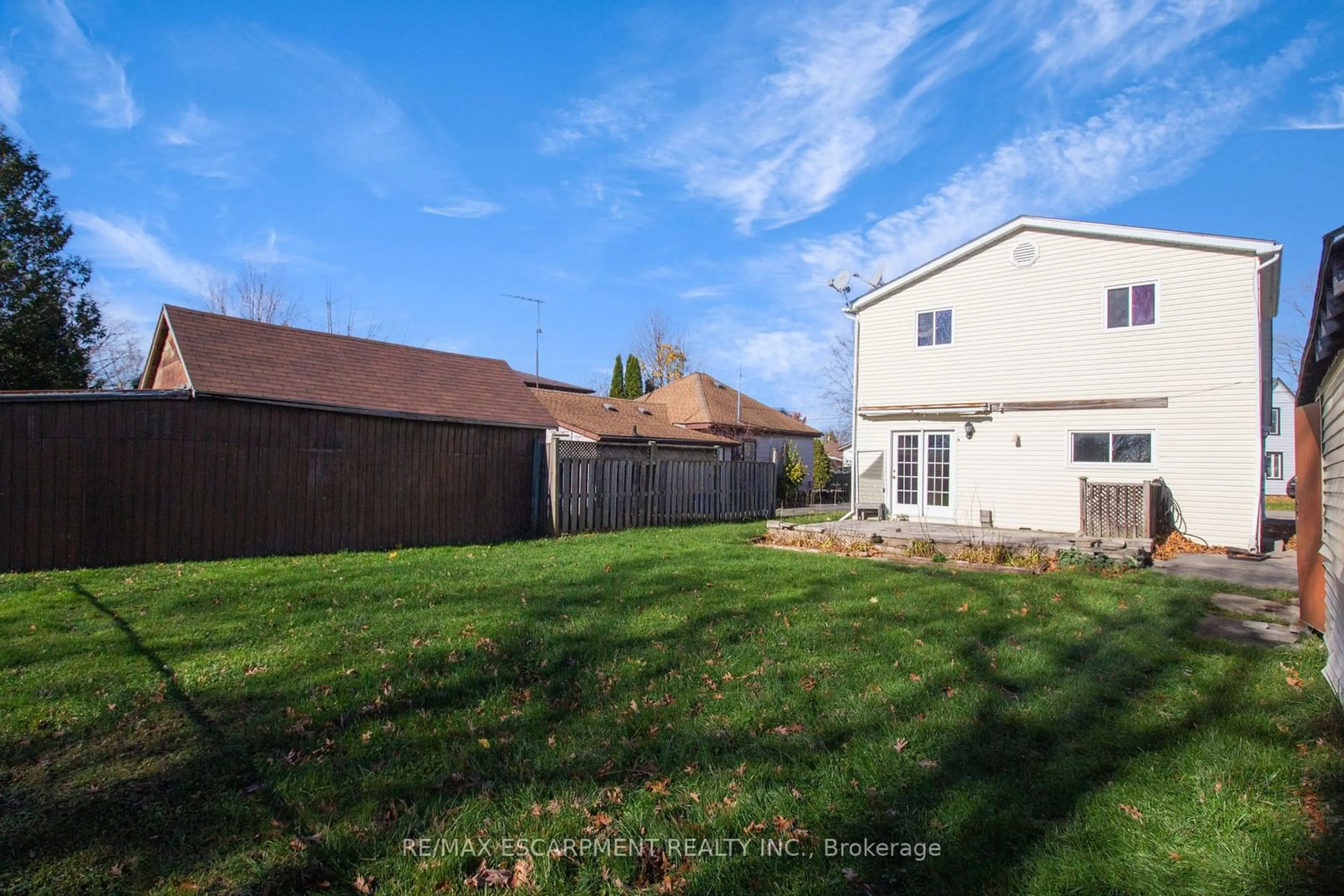 Frontside or backside of a home, the fenced backyard for 5 Porter Ave, Haldimand Ontario N0A 1H0