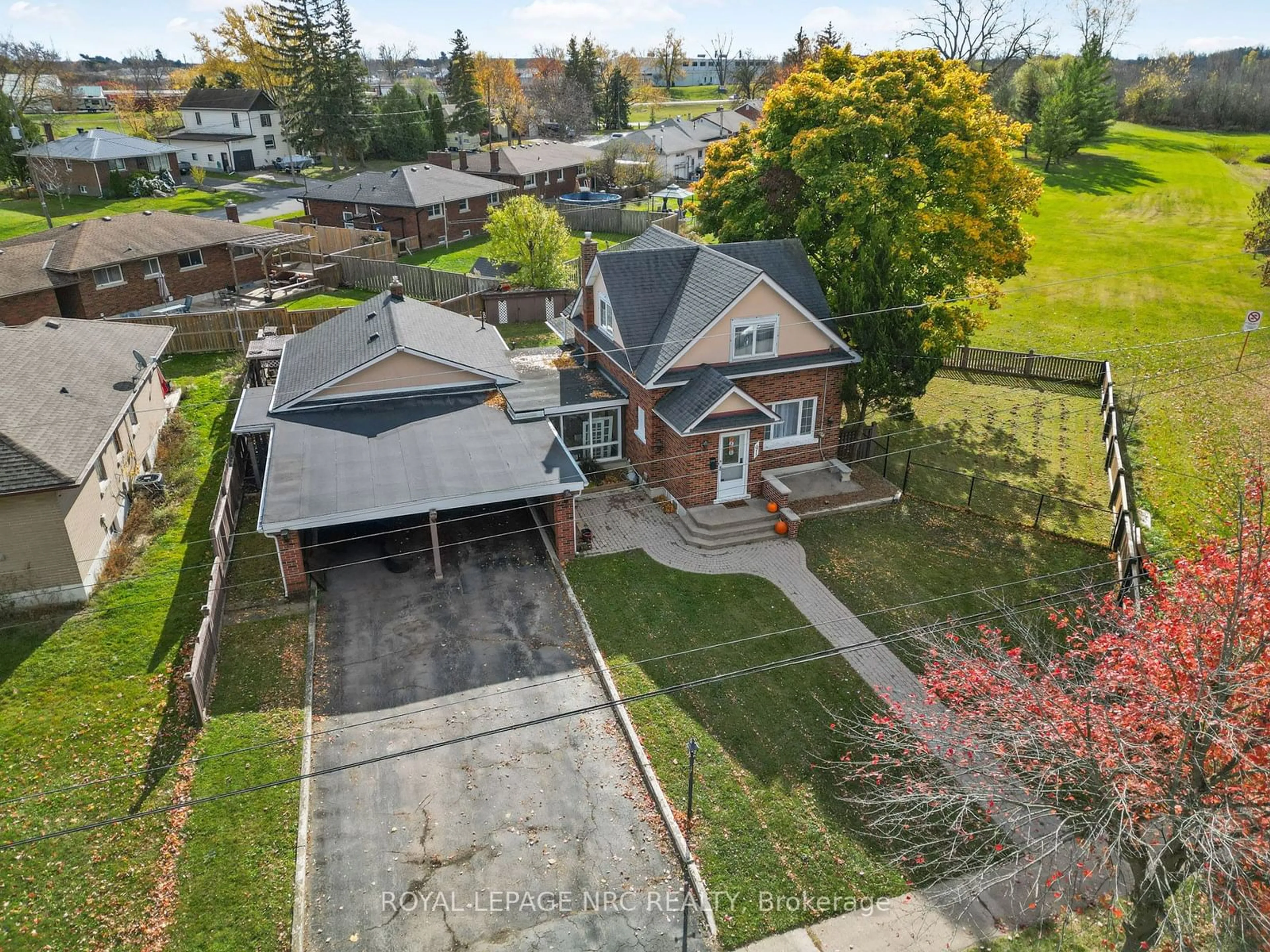 Frontside or backside of a home, the fenced backyard for 91 Saint George St, Welland Ontario L3C 5N3