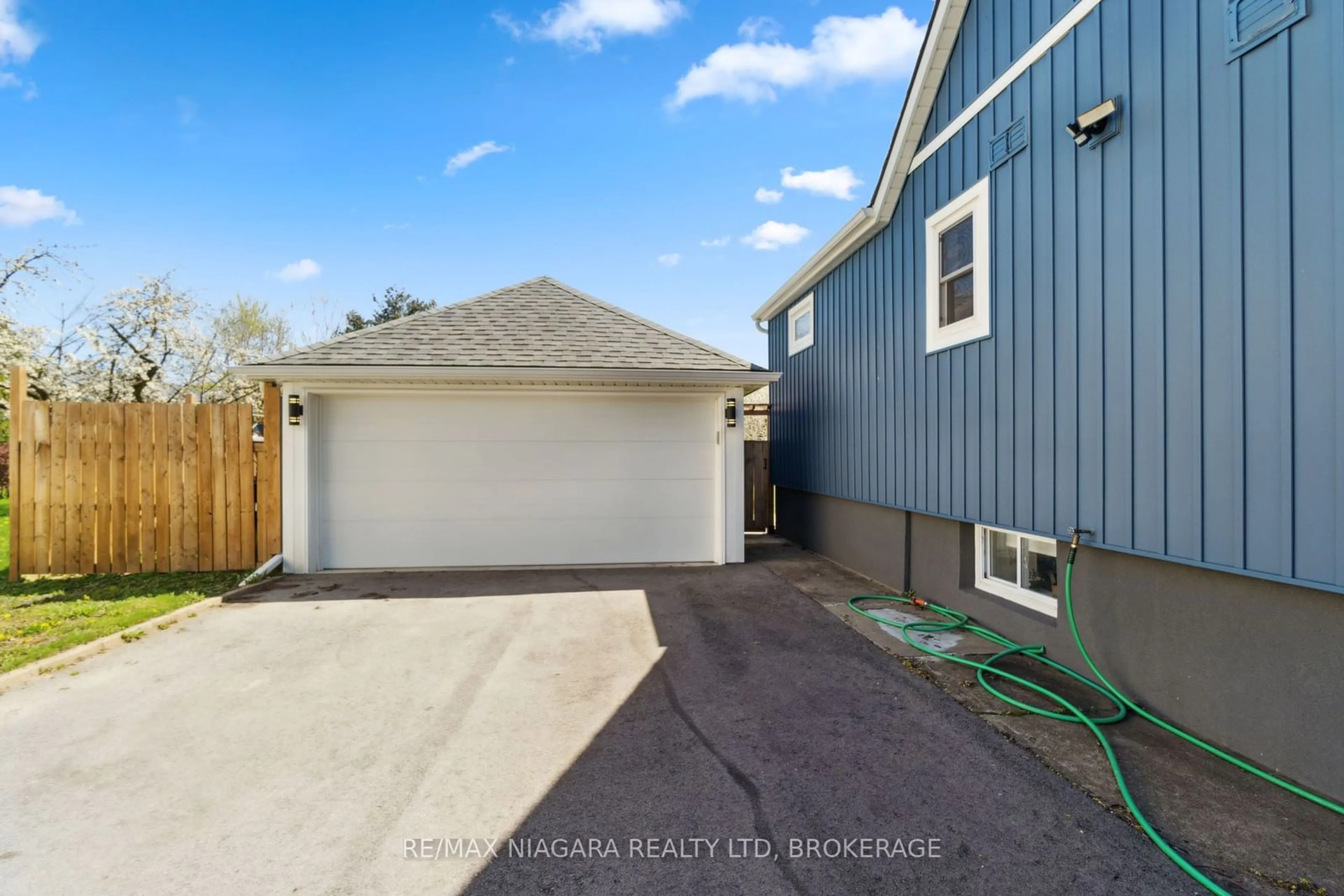 Frontside or backside of a home, the fenced backyard for 52 GHENT St, St. Catharines Ontario L2N 2C7