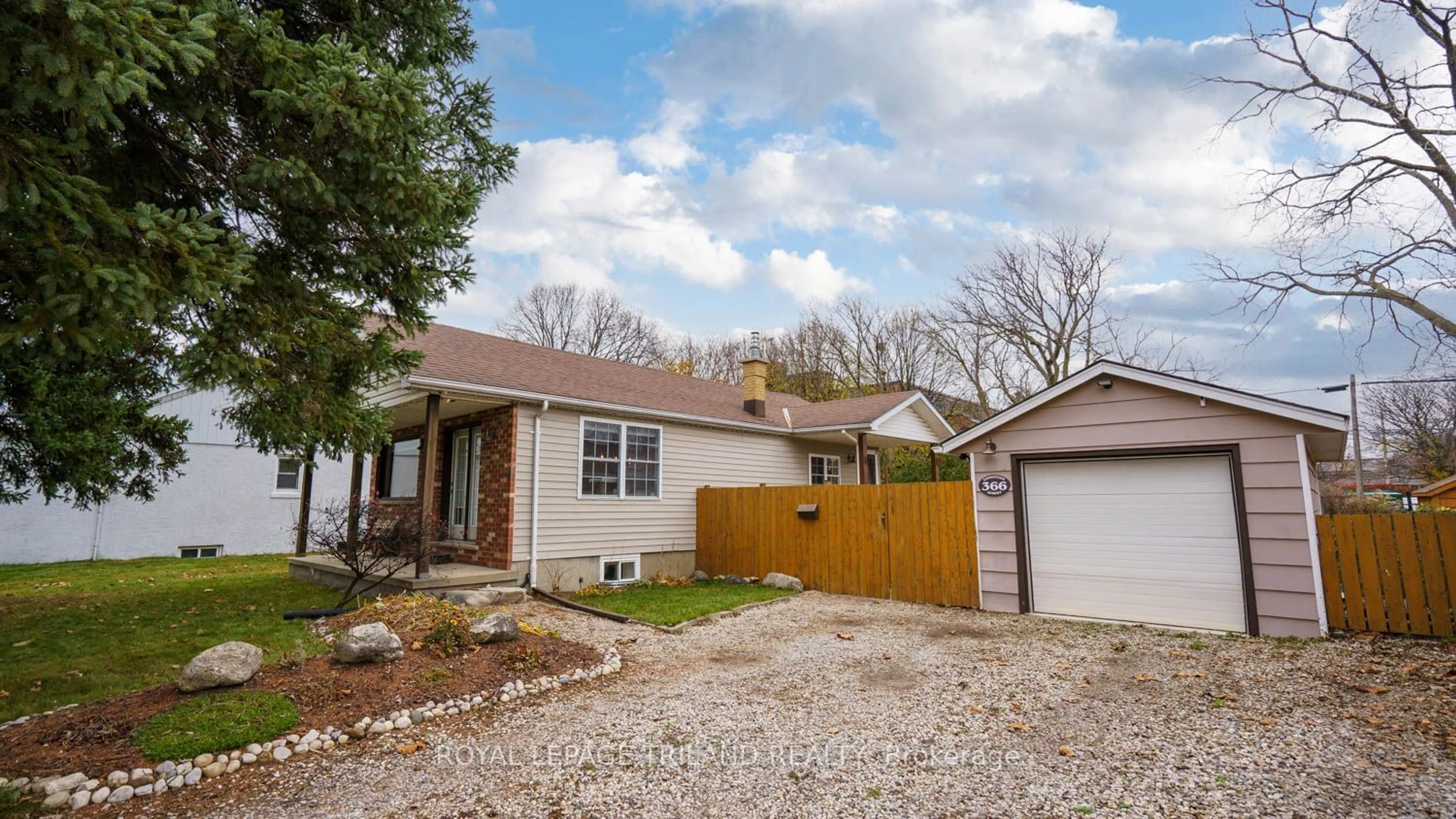 Frontside or backside of a home, the fenced backyard for 366 Edmonton St, London Ontario N5W 4Y5