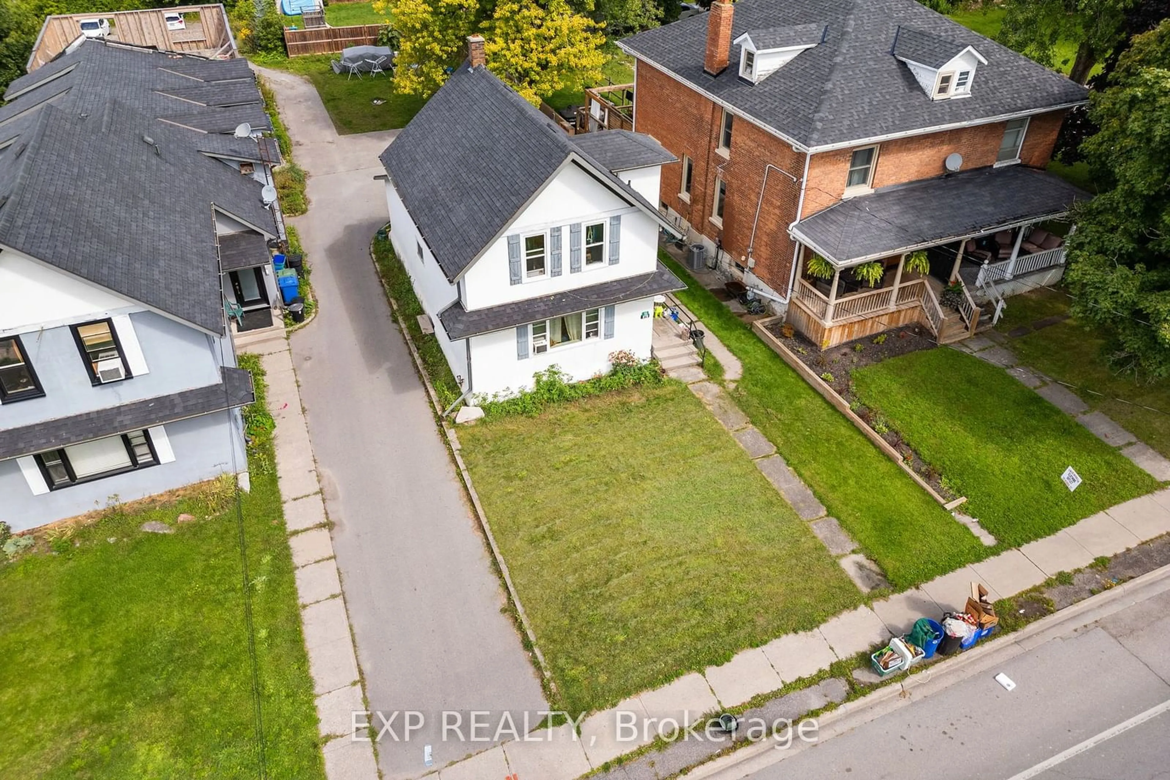 Frontside or backside of a home, the fenced backyard for 86 Queen St, Kawartha Lakes Ontario K9V 1G4