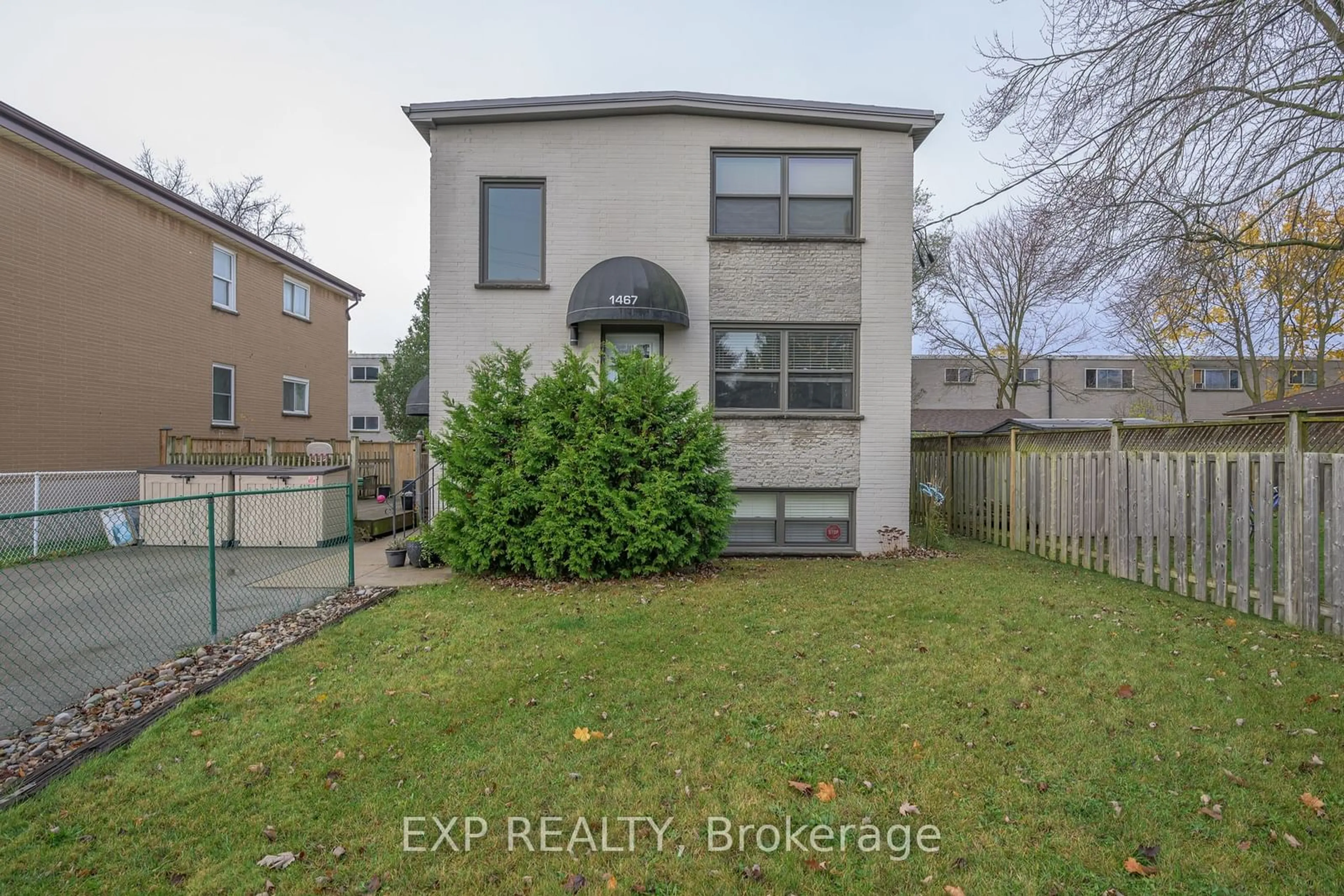 Frontside or backside of a home, the fenced backyard for 1467 Mclarenwood Terr, London Ontario N5W 1X8