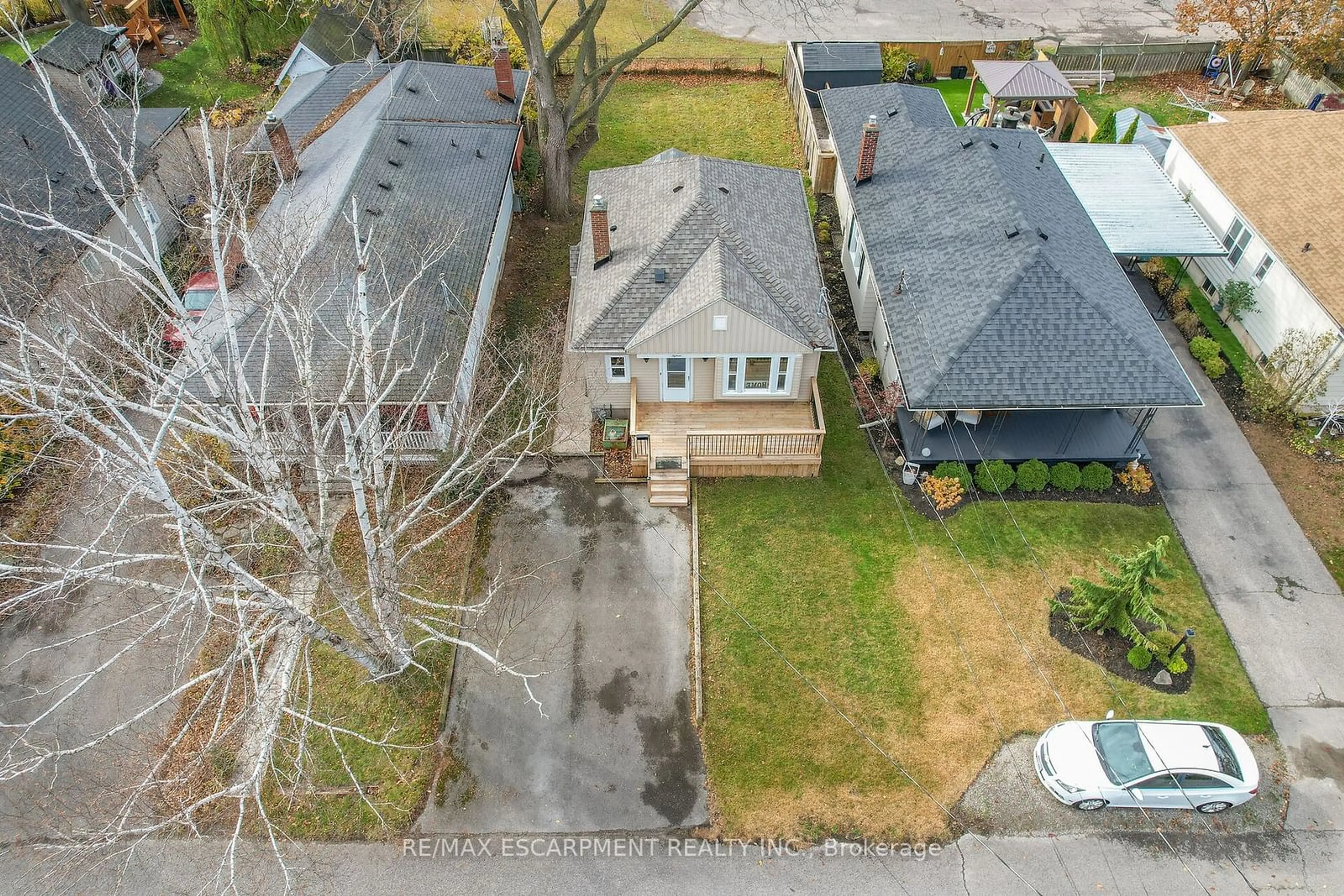 Frontside or backside of a home, the fenced backyard for 15 Verdun Ave, St. Catharines Ontario L2N 5L8