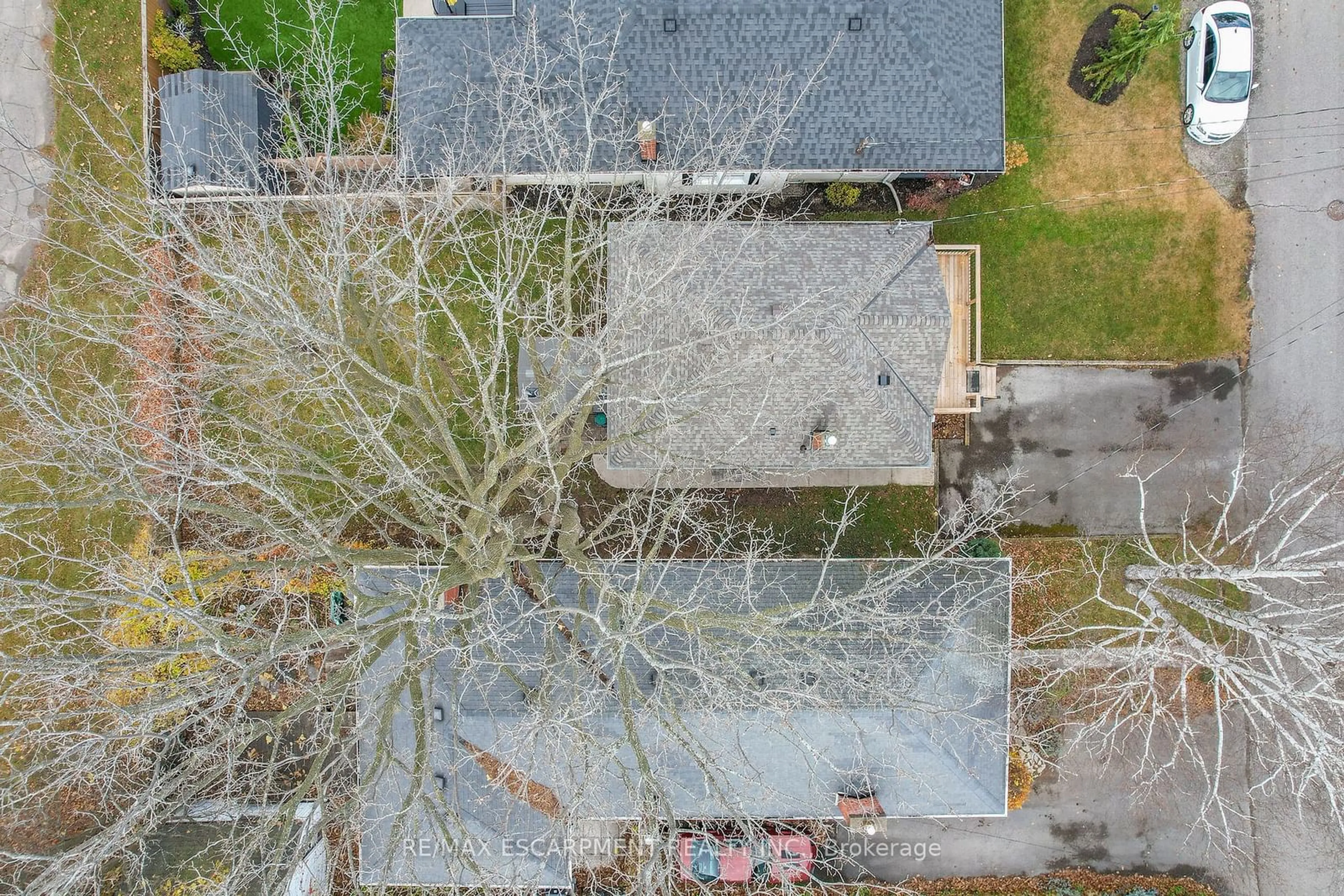 Frontside or backside of a home, the fenced backyard for 15 Verdun Ave, St. Catharines Ontario L2N 5L8