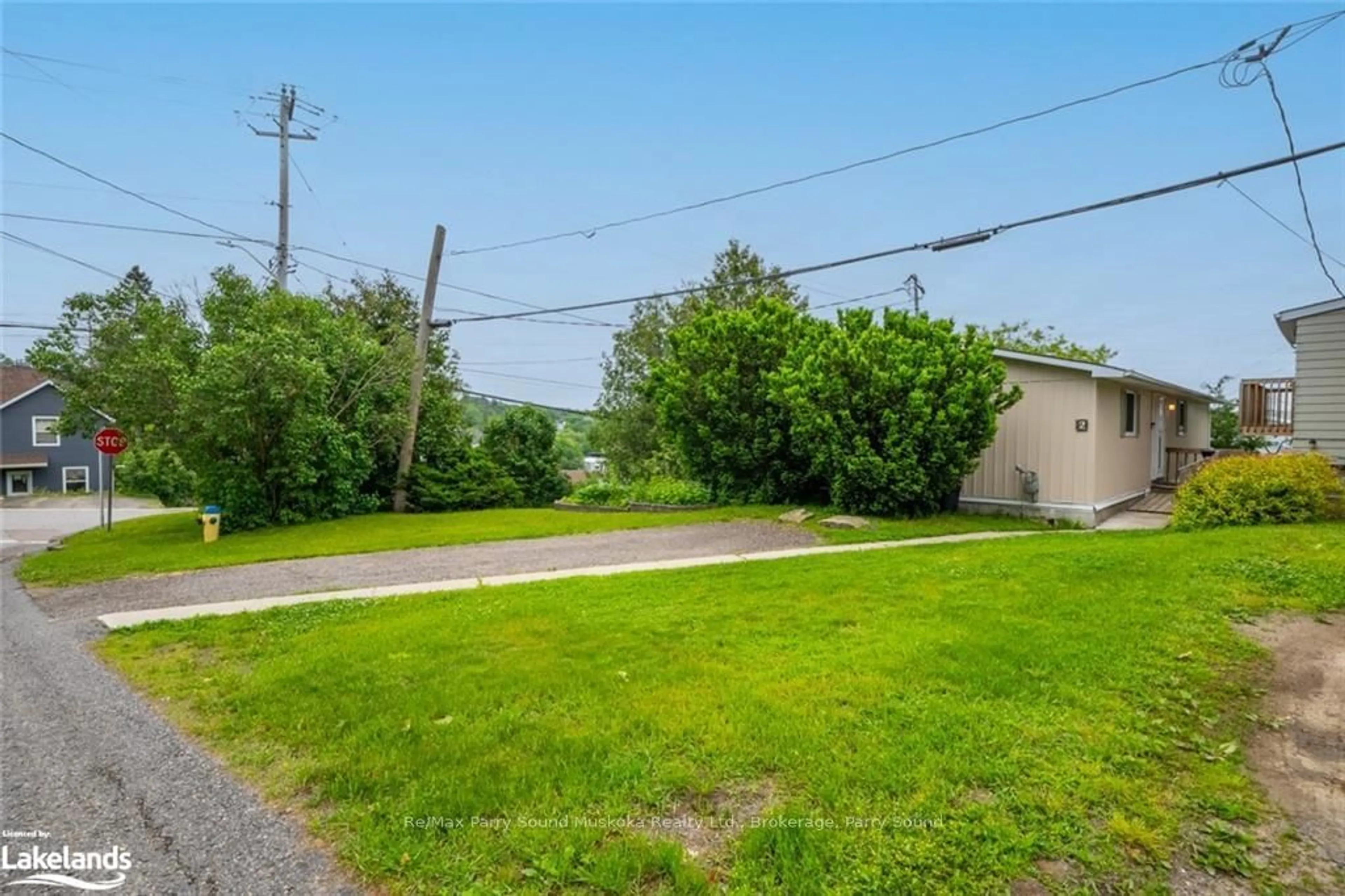 A pic from exterior of the house or condo, the fenced backyard for 2 BELVEDERE Ave, Parry Sound Ontario P2A 1Z9