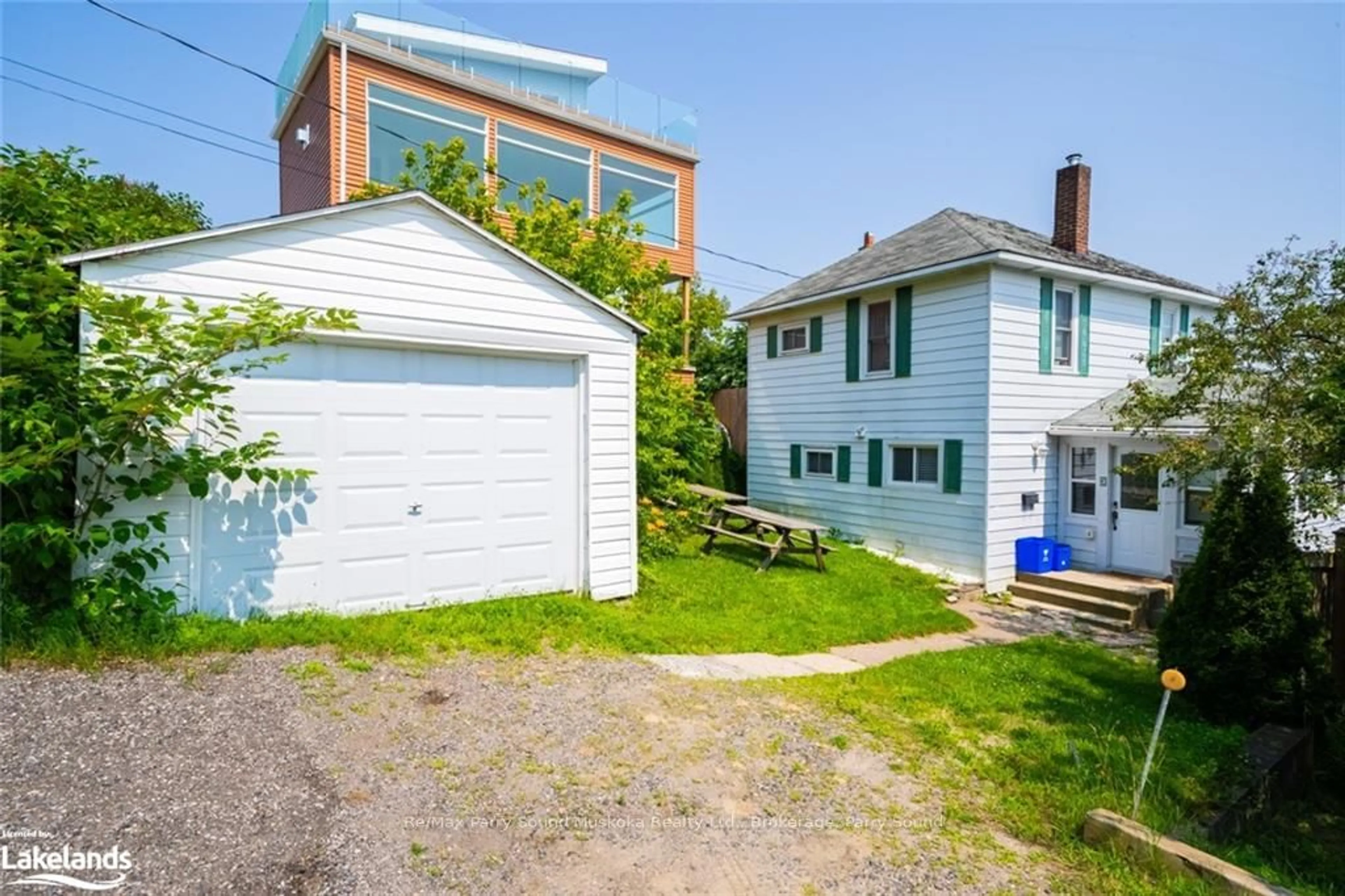 Frontside or backside of a home, the fenced backyard for 3 GIBSON St, Parry Sound Ontario P2A 1W5