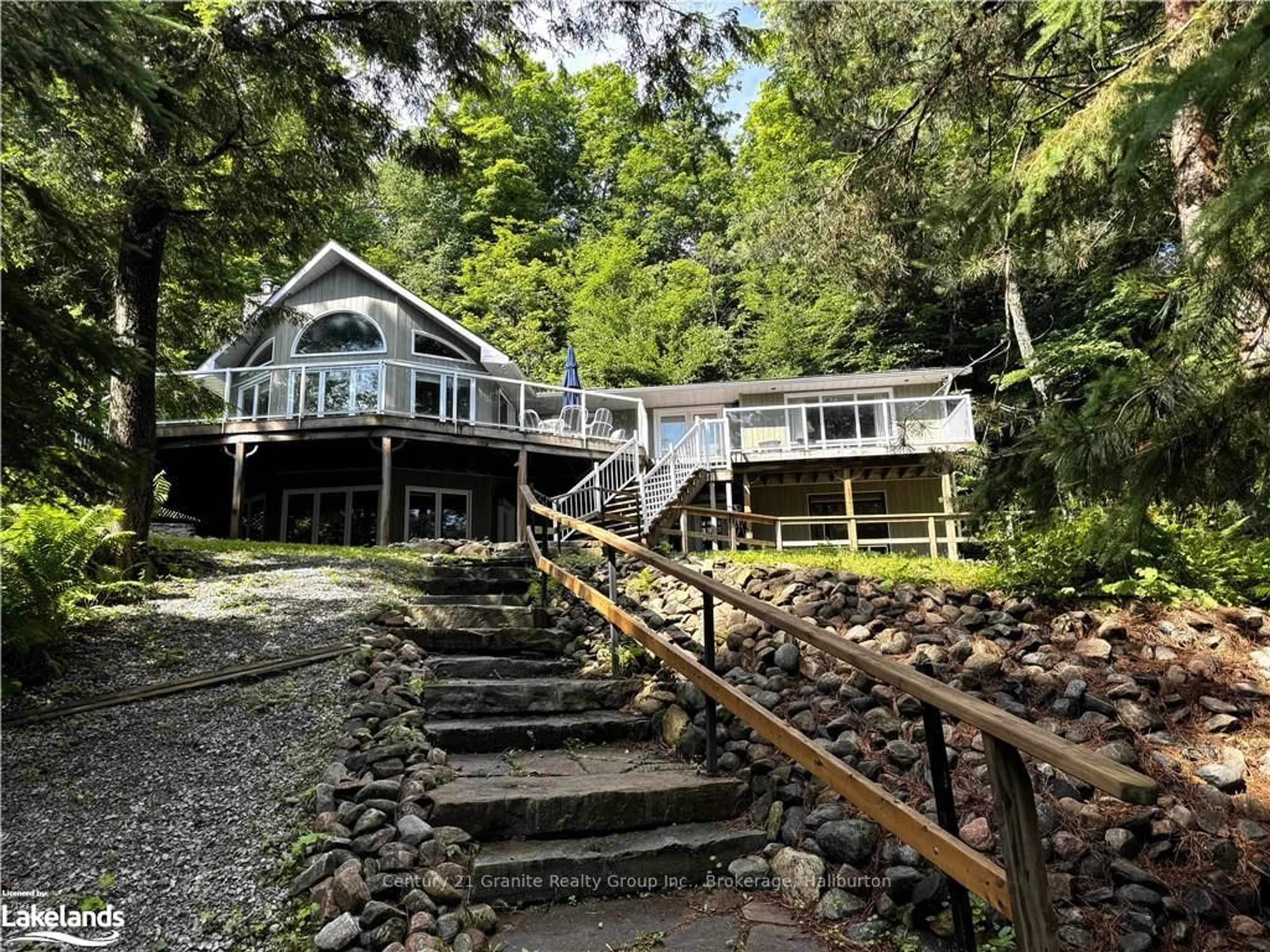 A pic from outside/outdoor area/front of a property/back of a property/a pic from drone, water/lake/river/ocean view for 1016 PEGG Dr, Dysart et al Ontario K0M 1S0