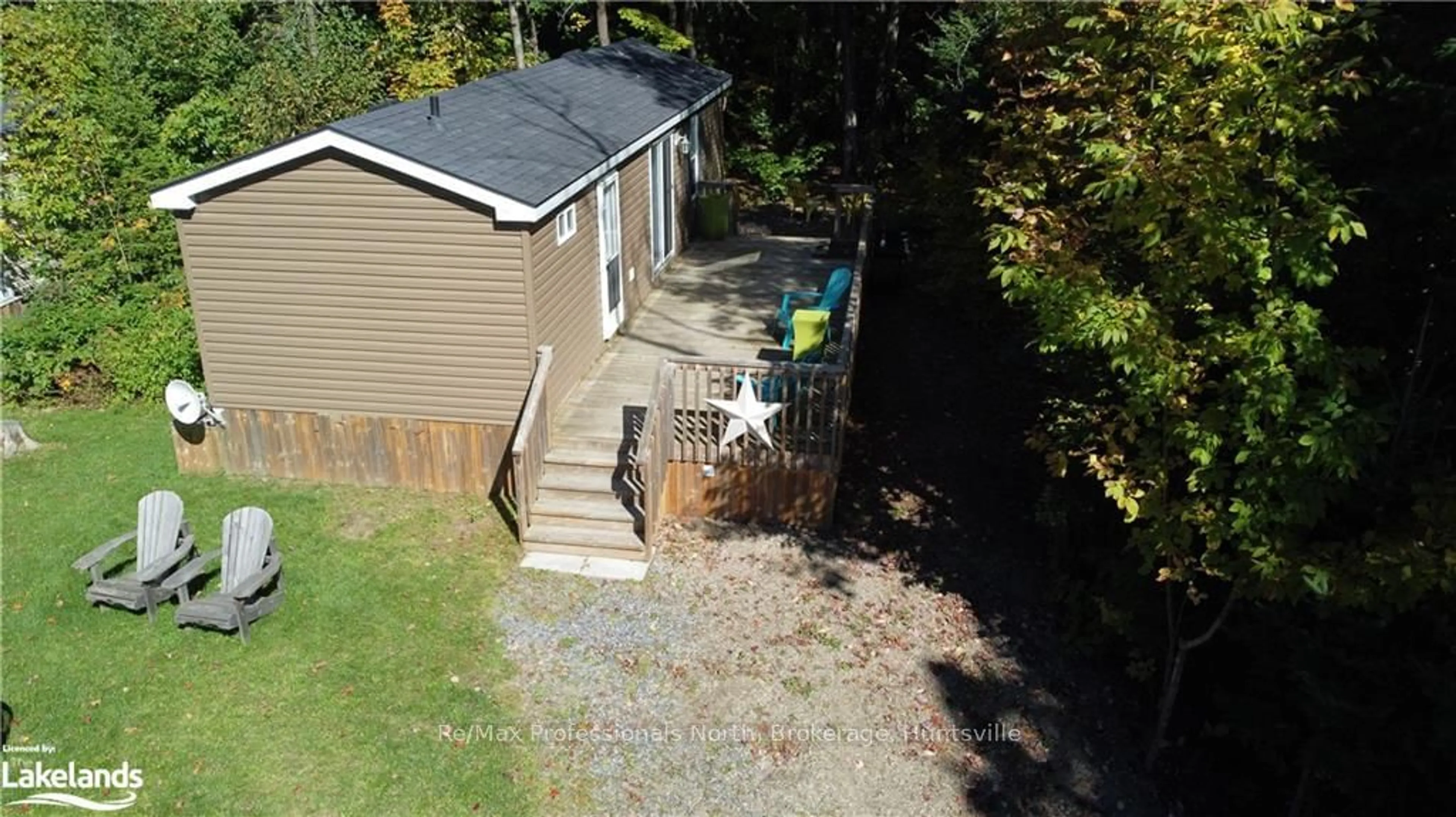 A pic from exterior of the house or condo, the fenced backyard for 1047 BONNIE LAKE CAMP Rd #548, Bracebridge Ontario P1H 2A8