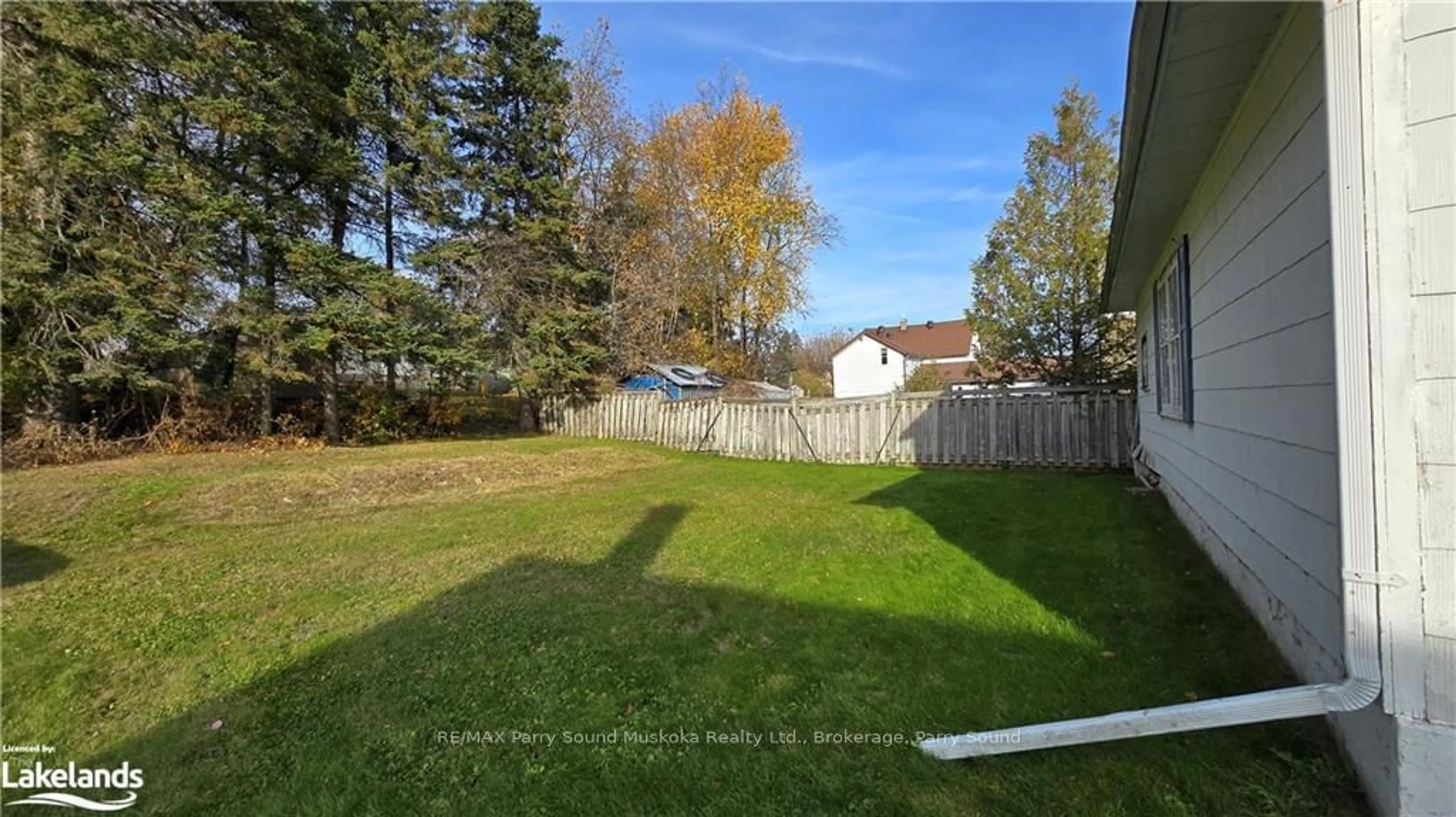 A pic from exterior of the house or condo, the fenced backyard for 155 HUSTON ST St, Burk's Falls Ontario P0A 1C0