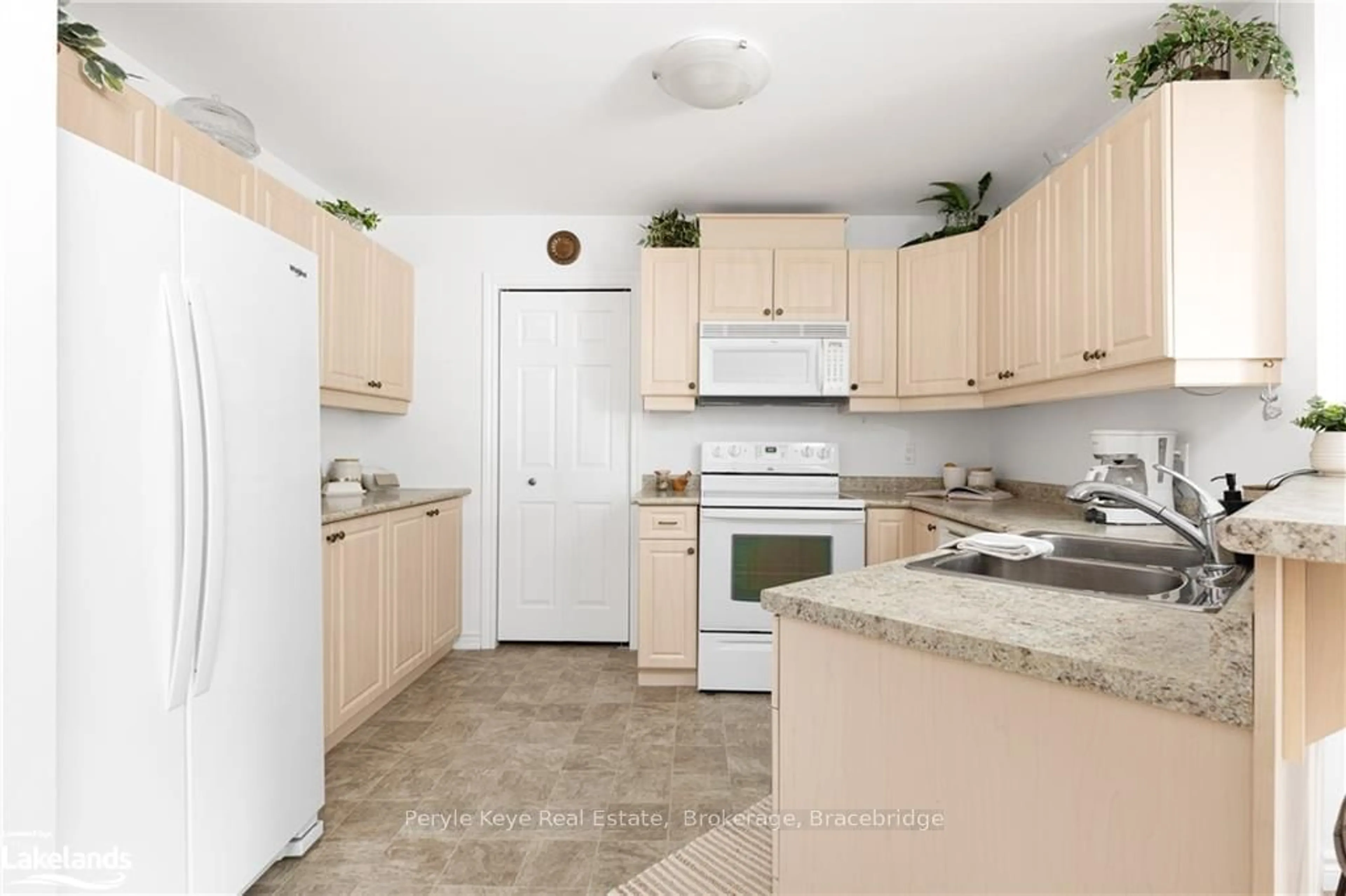 Standard kitchen, ceramic floors, cottage for 24 DAIRY Lane #206, Huntsville Ontario P1H 0A4