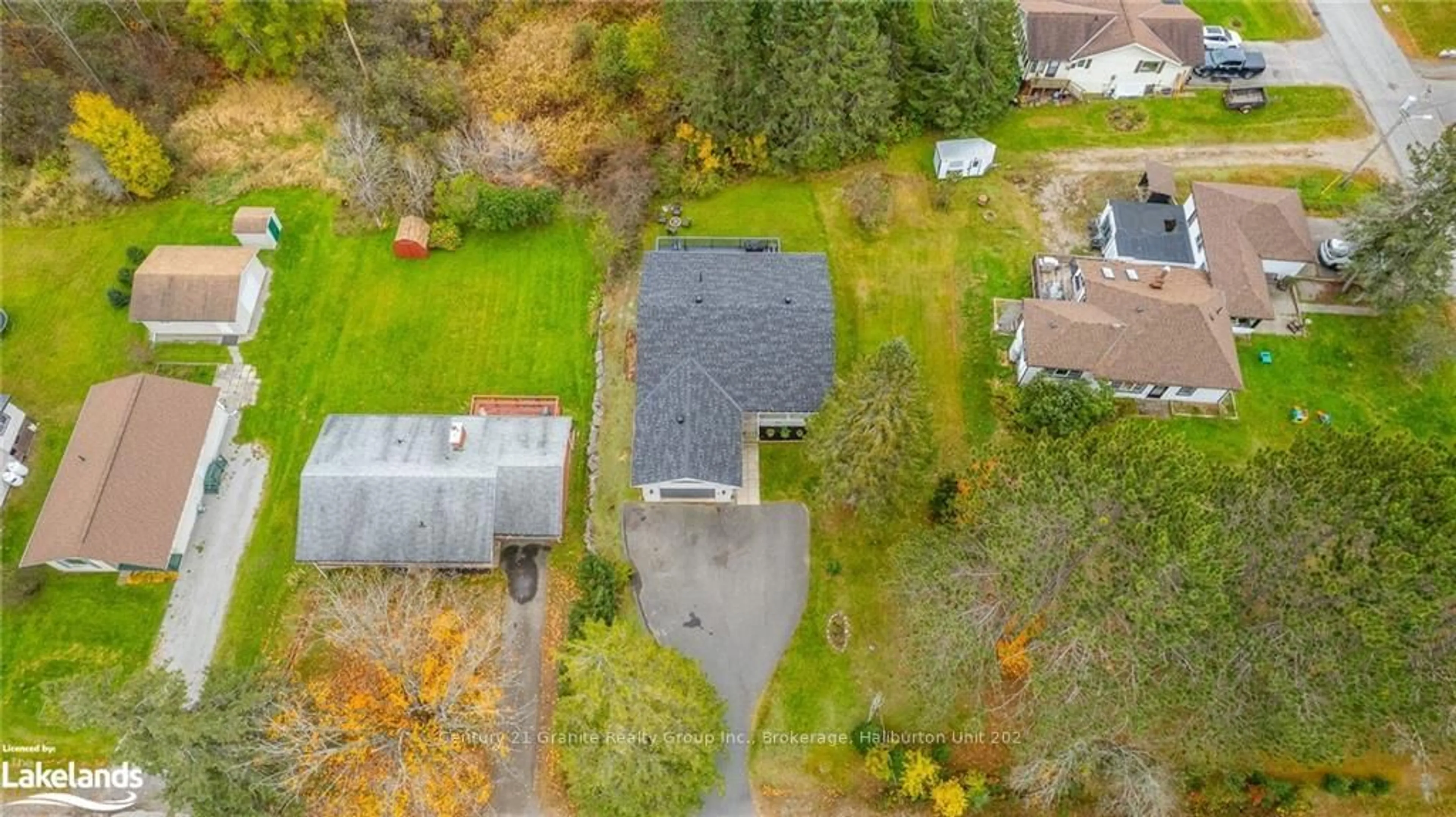 Frontside or backside of a home, the fenced backyard for 8 MCKAY St, Minden Hills Ontario K0M 2K0