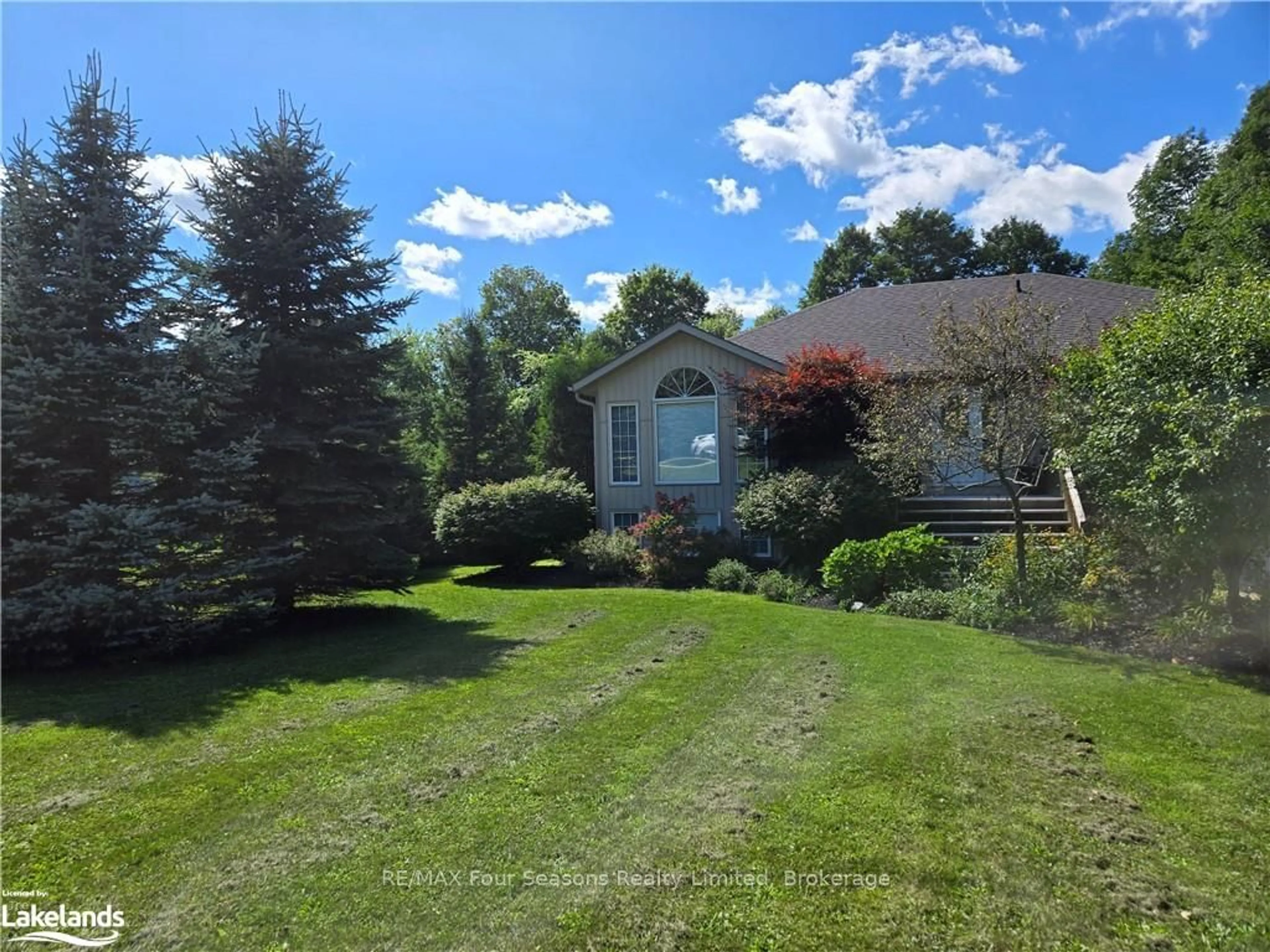 Frontside or backside of a home, the fenced backyard for 154 SUTTER St, Grey Highlands Ontario N0C 1E0