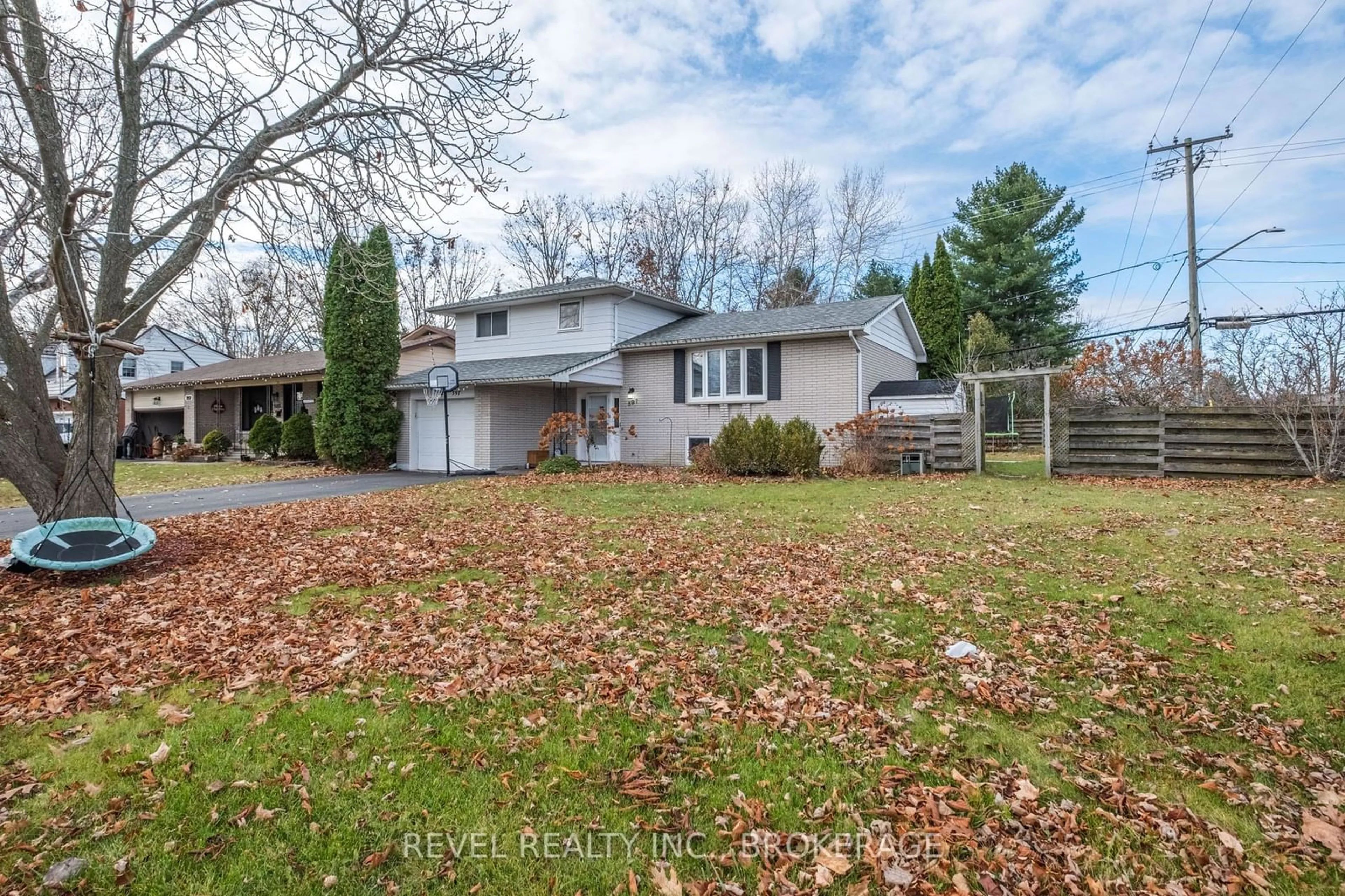 Frontside or backside of a home, the fenced backyard for 397 Chelsea Rd, Kingston Ontario K7M 4A2