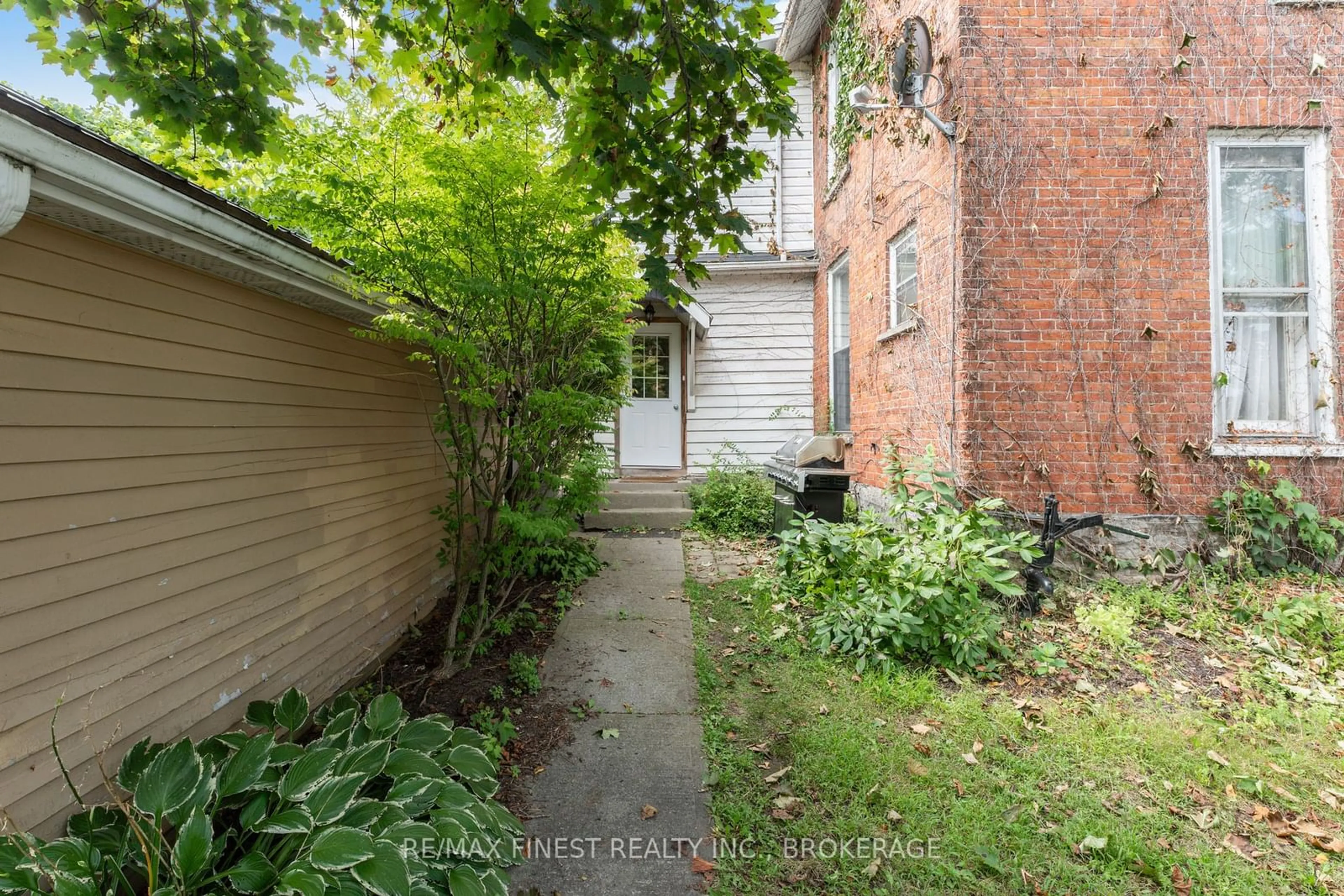 A pic from exterior of the house or condo, the fenced backyard for 220 Dundas St, Greater Napanee Ontario K7R 2A8