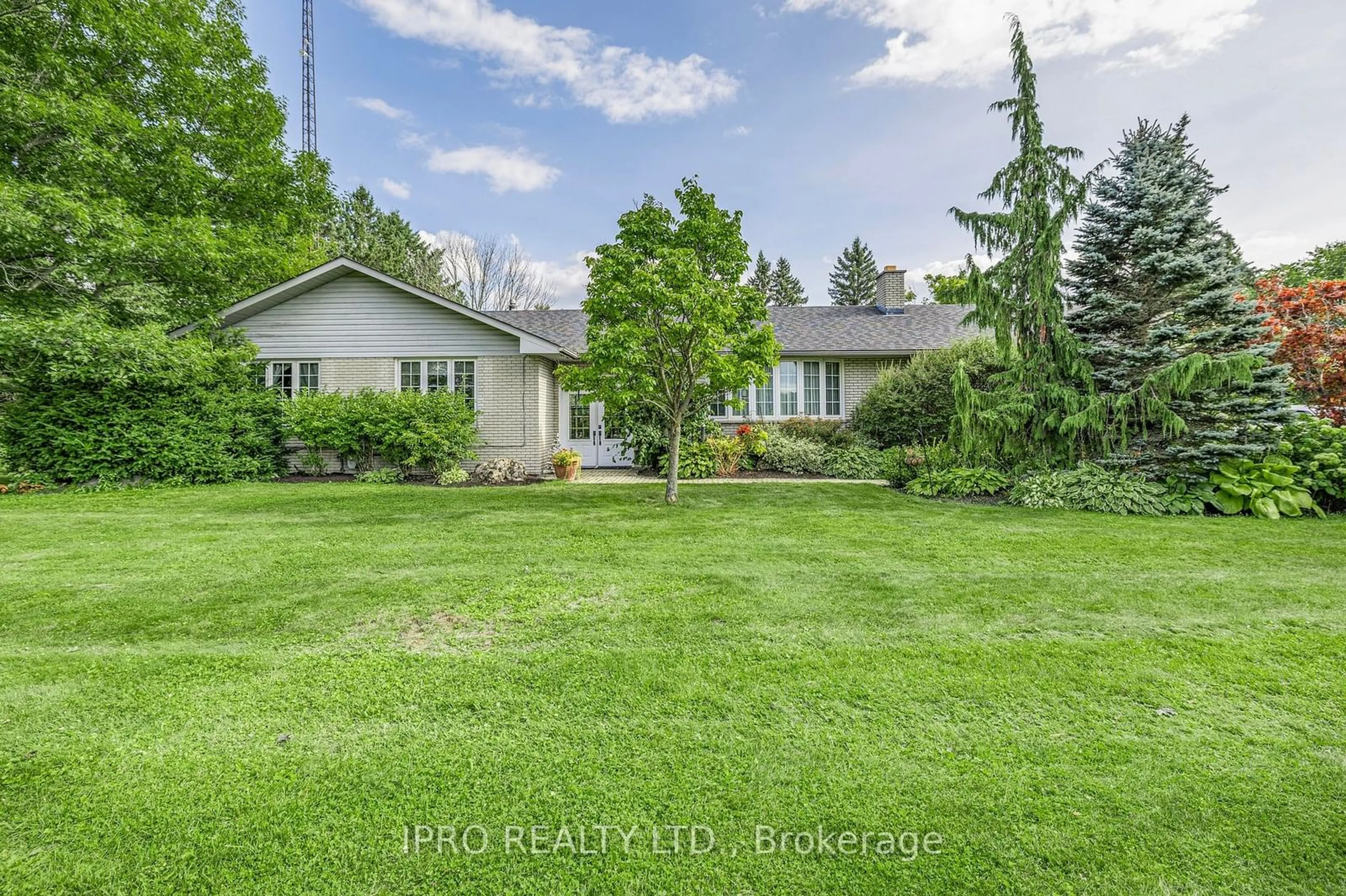 Frontside or backside of a home, the fenced backyard for 246044 County Rd 16 Rd, Mono Ontario L9W 6K2