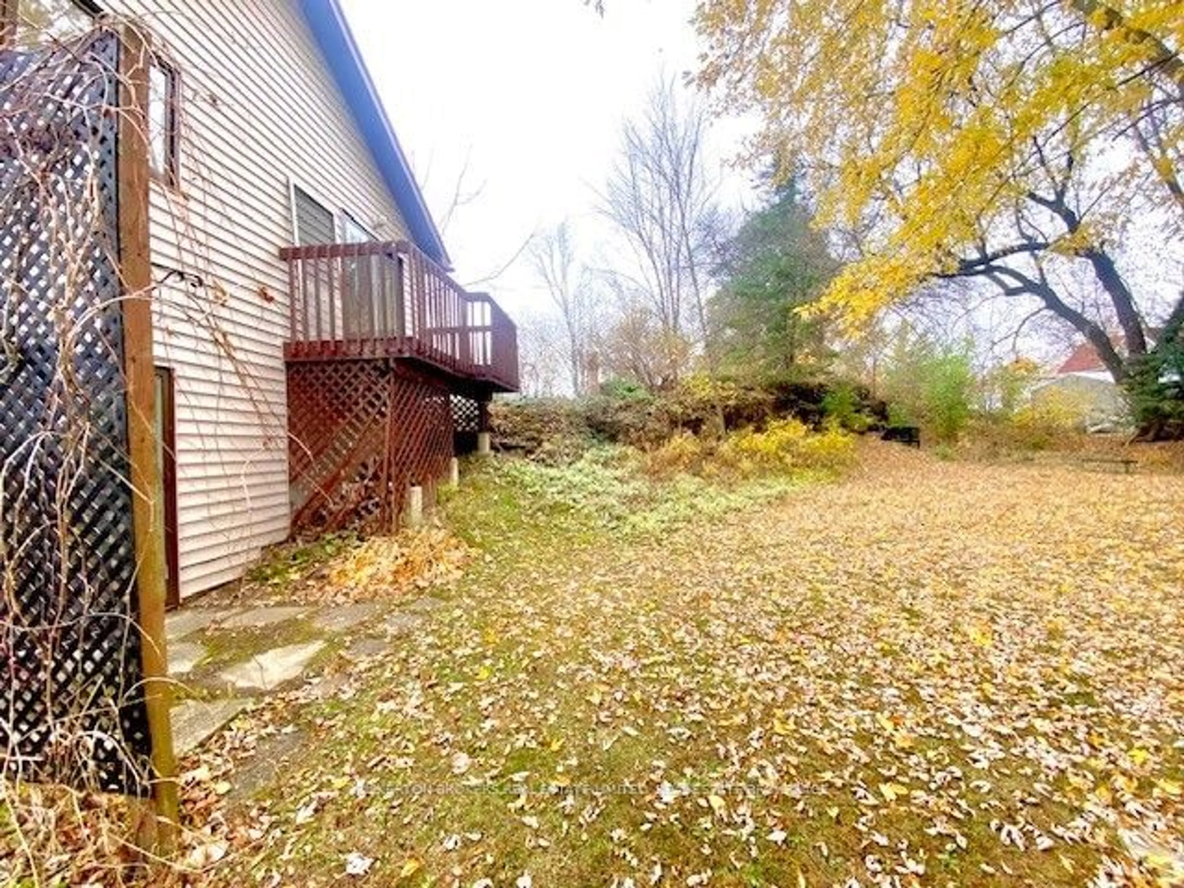 Frontside or backside of a home, the fenced backyard for 625 Queen St, Gananoque Ontario K7G 2B3