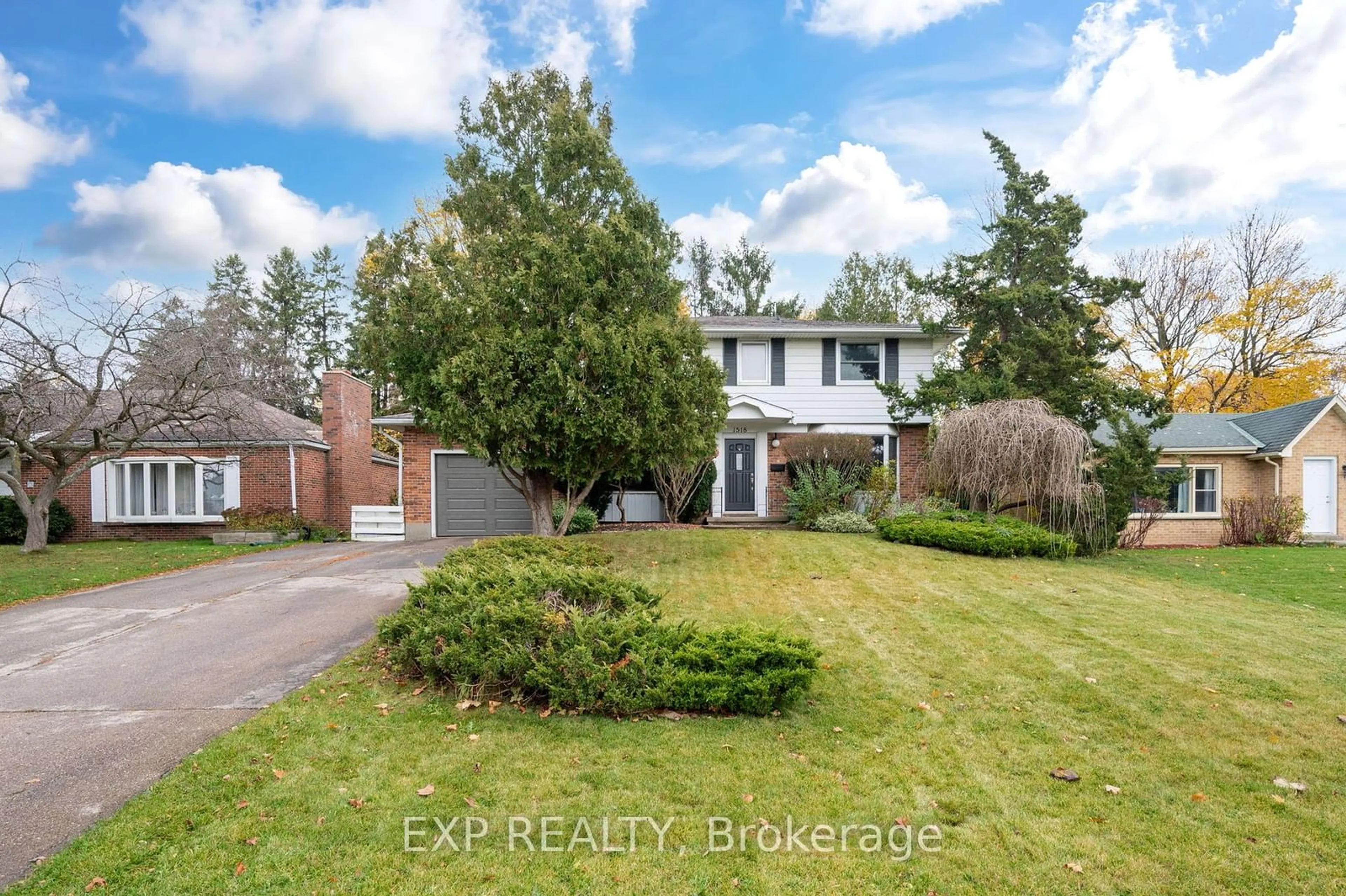 Frontside or backside of a home, the fenced backyard for 1518 Western Rd, London Ontario N6G 1H4