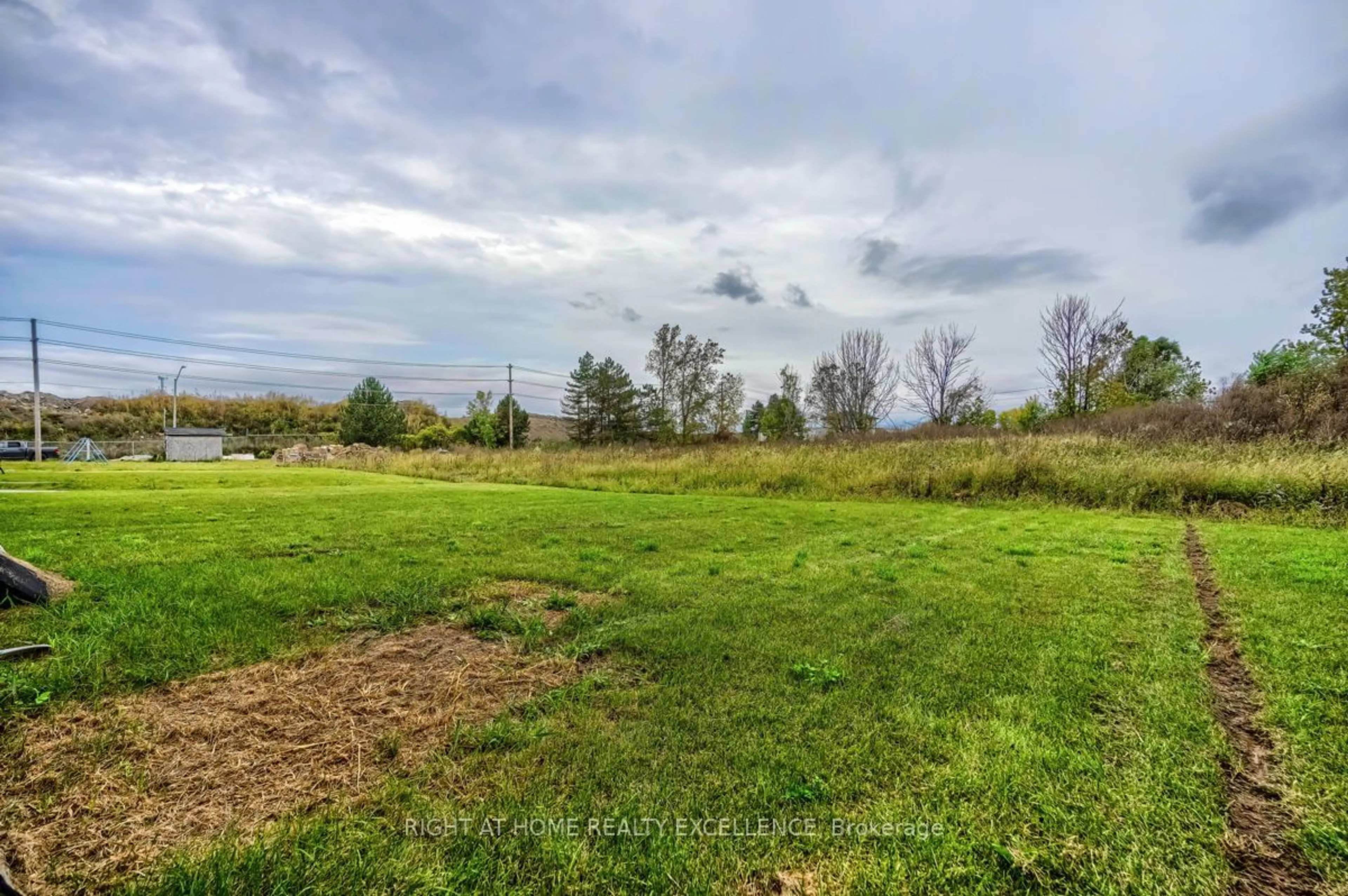 A pic from exterior of the house or condo, the fenced backyard for 380 Chaffey St, Welland Ontario L3B 2Z1