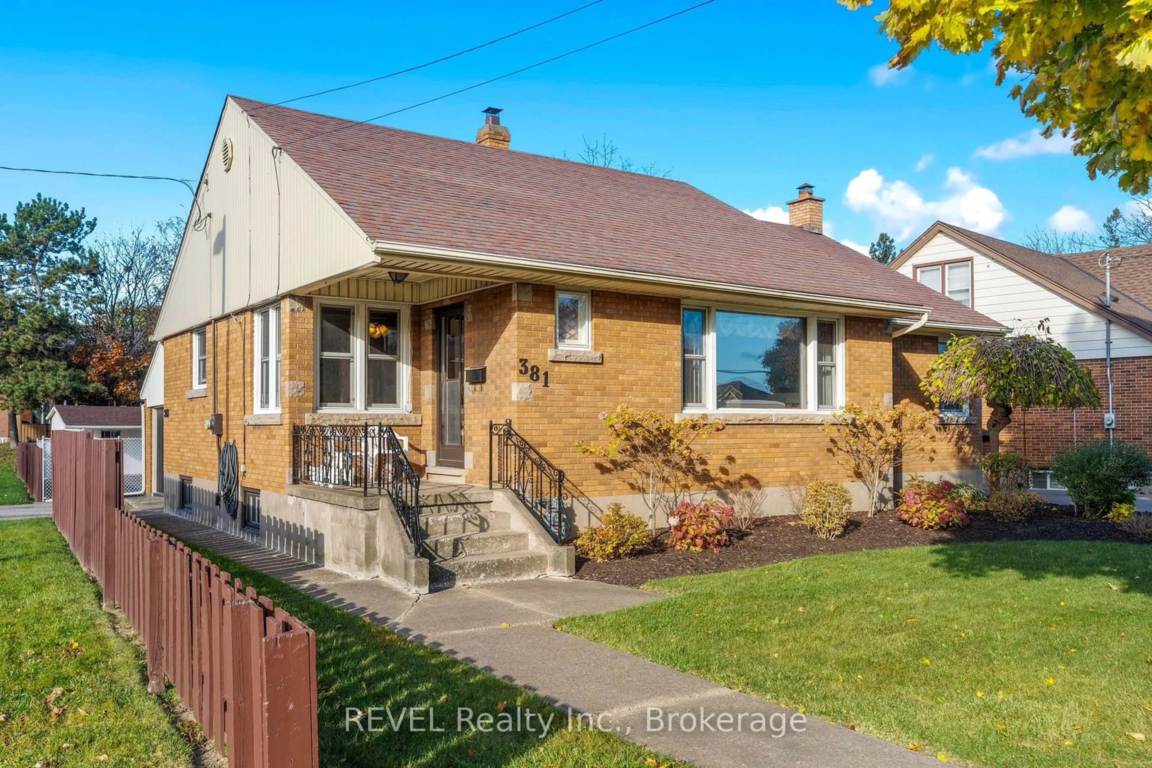 Frontside or backside of a home, the fenced backyard for 381 Niagara St, St. Catharines Ontario L2M 4V9