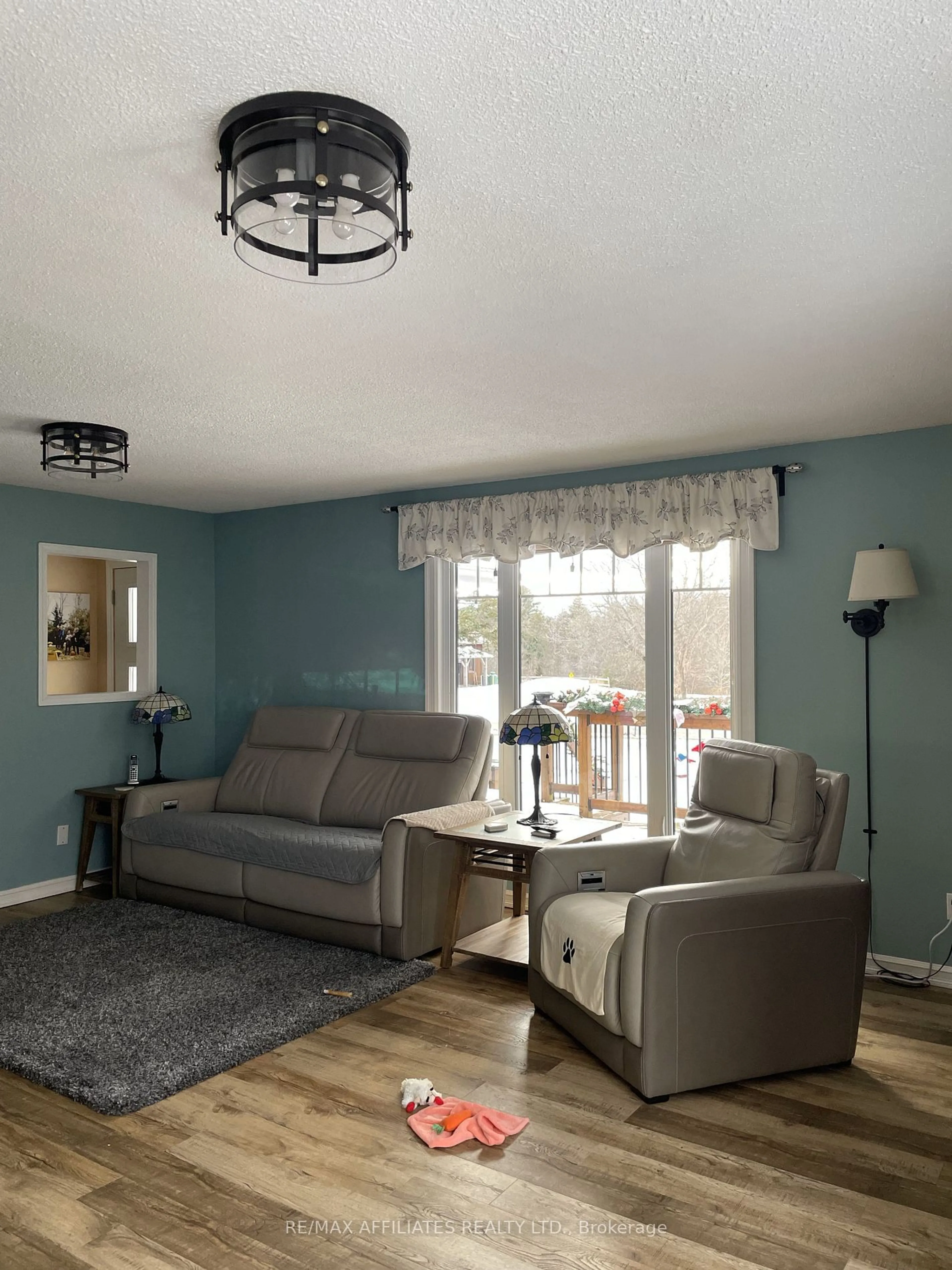 Living room with furniture, wood/laminate floor for 157 PERTH St, Rideau Lakes Ontario K0G 1E0