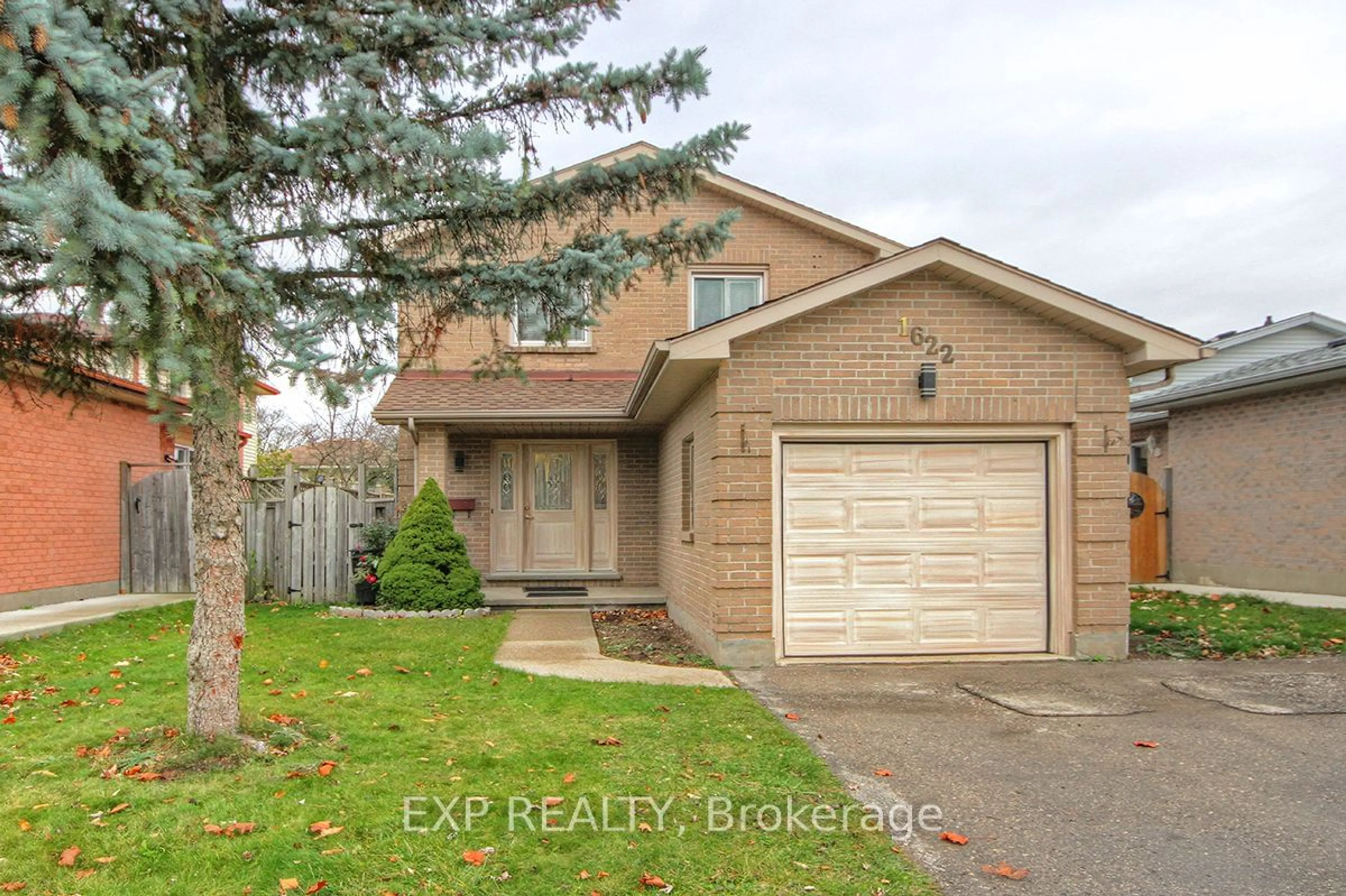 Frontside or backside of a home, the fenced backyard for 1622 Jalna Blvd, London Ontario N6E 3L1